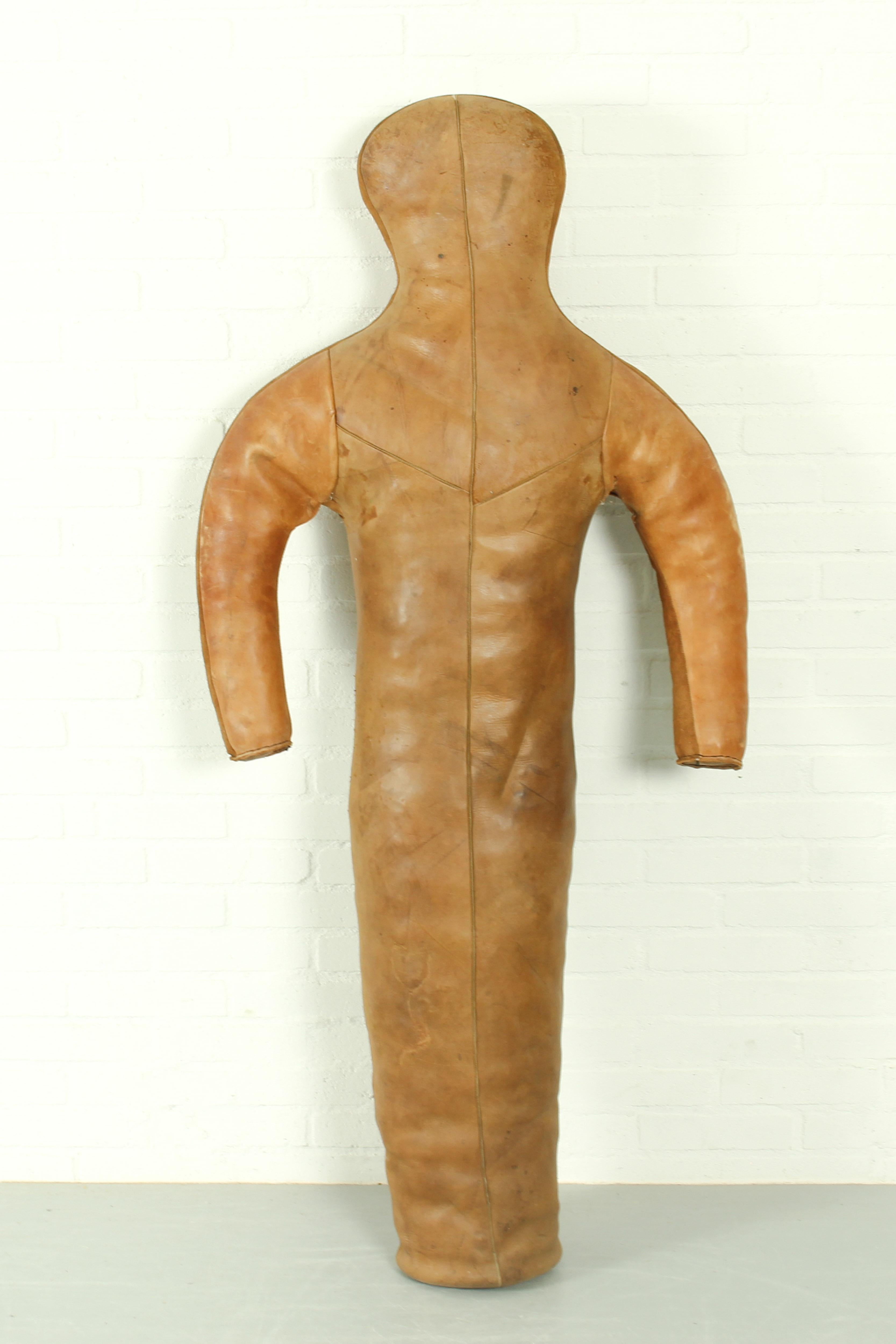 Super rare to find a vintage brown leather boxing dummy from the 1930s with very nice patina and some damage in accordance with age. 

Dimensions: Height: 148cm, Width: 70cm, 25cm d.
