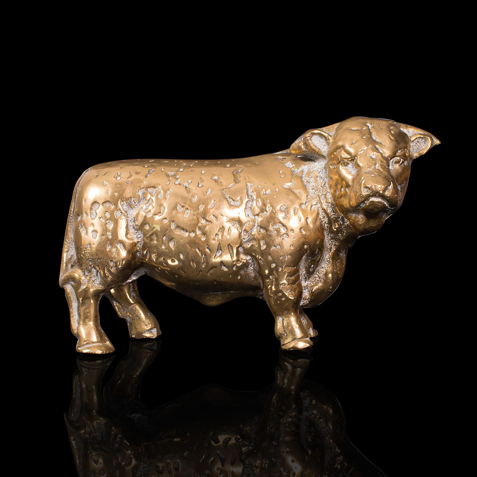 This is an antique decorative bull figure. An English, brass desk or display statue, dating to the Victorian period, circa 1900.

Charming Herefordshire Bull figure
Displays a desirable aged patina and light tarnish
Polished brass presents