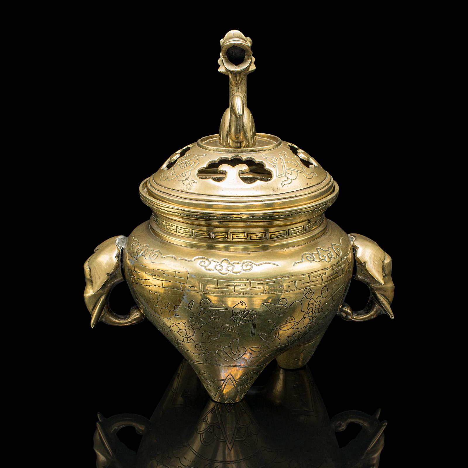 
This is an antique decorative censer. A Chinese, brass incense burner with dragon and elephant motif, dating to the late Victorian period, circa 1900.

Appealing Qing dynasty censer with a striking visual form
Displays a desirable aged patina and