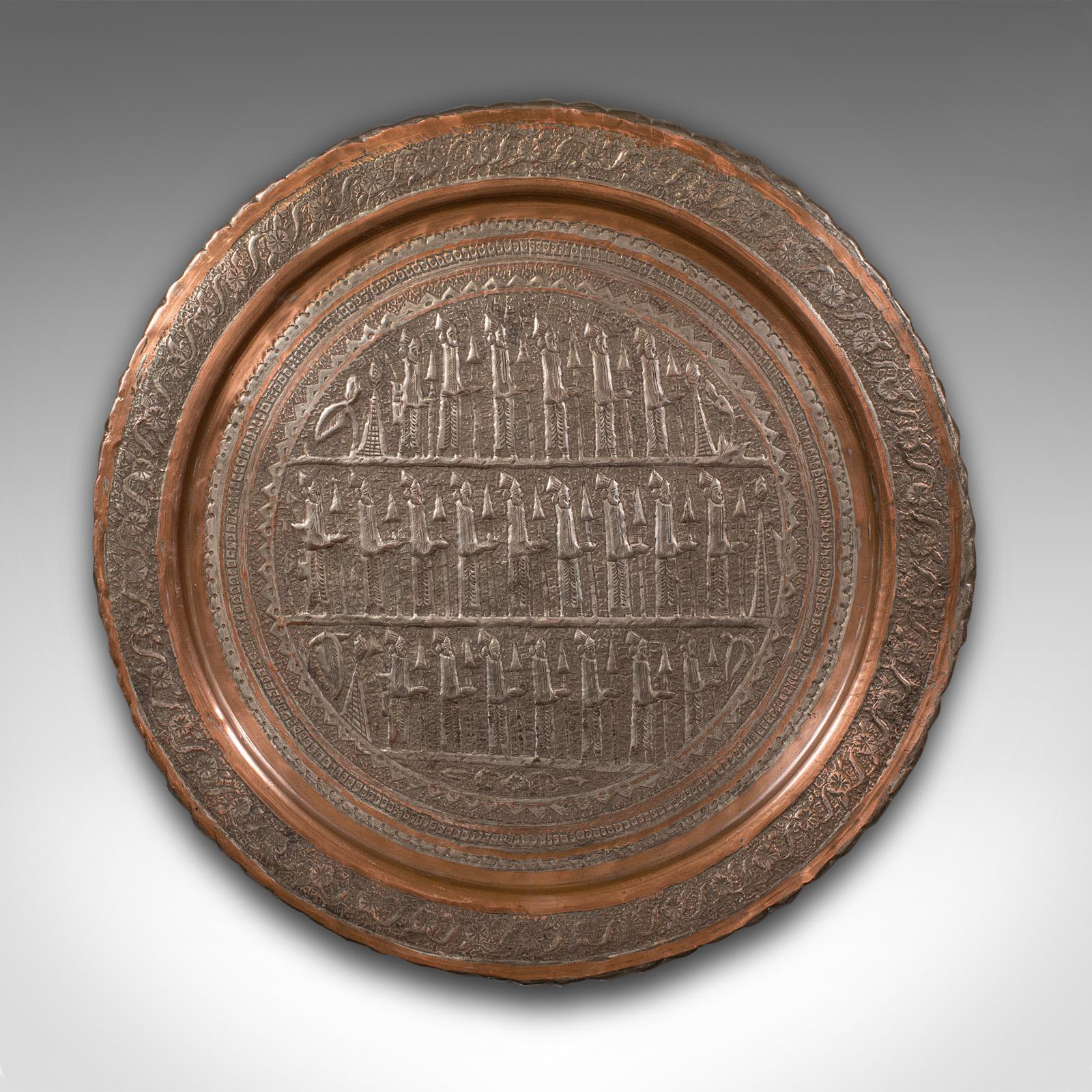 This is an antique decorative charger. A Turkish, copper repousse wall plate, dating to the early Victorian period, circa 1850.

Superb Ottoman period plate with fascinating detail
Displays a desirable aged patina and in good original order
Silvered