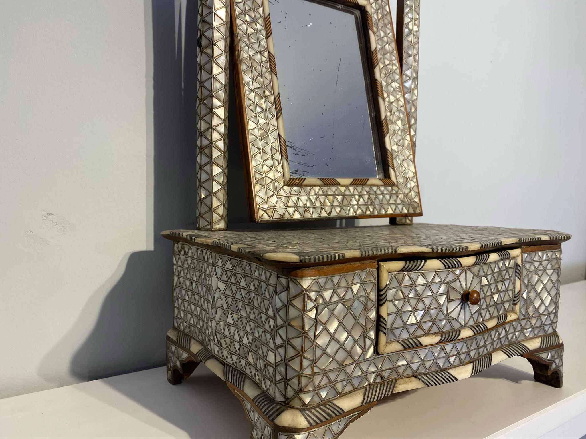 small antique vanity with mirror