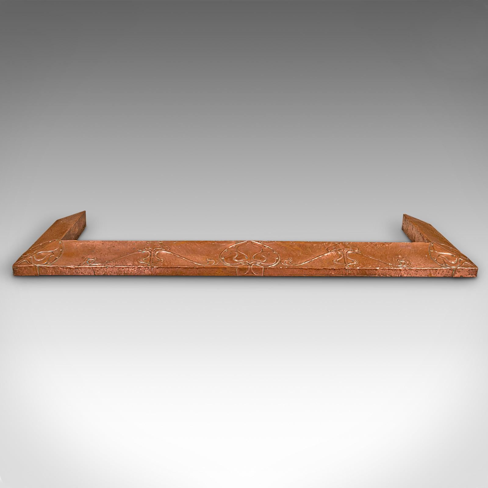 This is an antique decorative fire kerb. An English, copper fireside hearth surround in Art Nouveau taste, dating to the late Victorian period, circa 1900.

Accentuate your grand fireplace with this dashing fire kerb
Displays a desirable aged patina