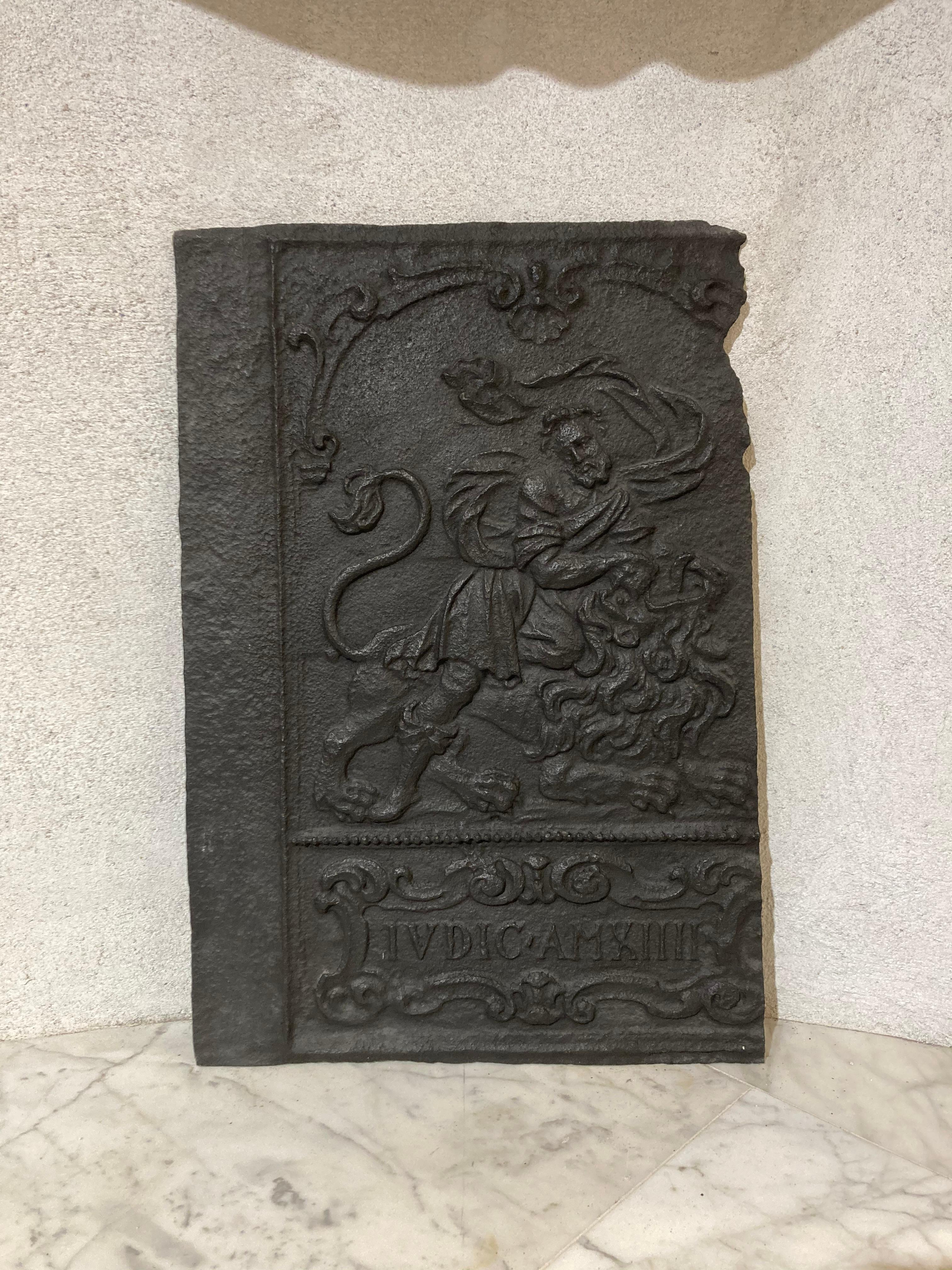 A nice and tall decorative fireback or backsplash.
This was originally a sides of an old cast iron stove from the 17th century.
In the early 19th century these decorative stove where take apart, the sides where used as fireback because of their