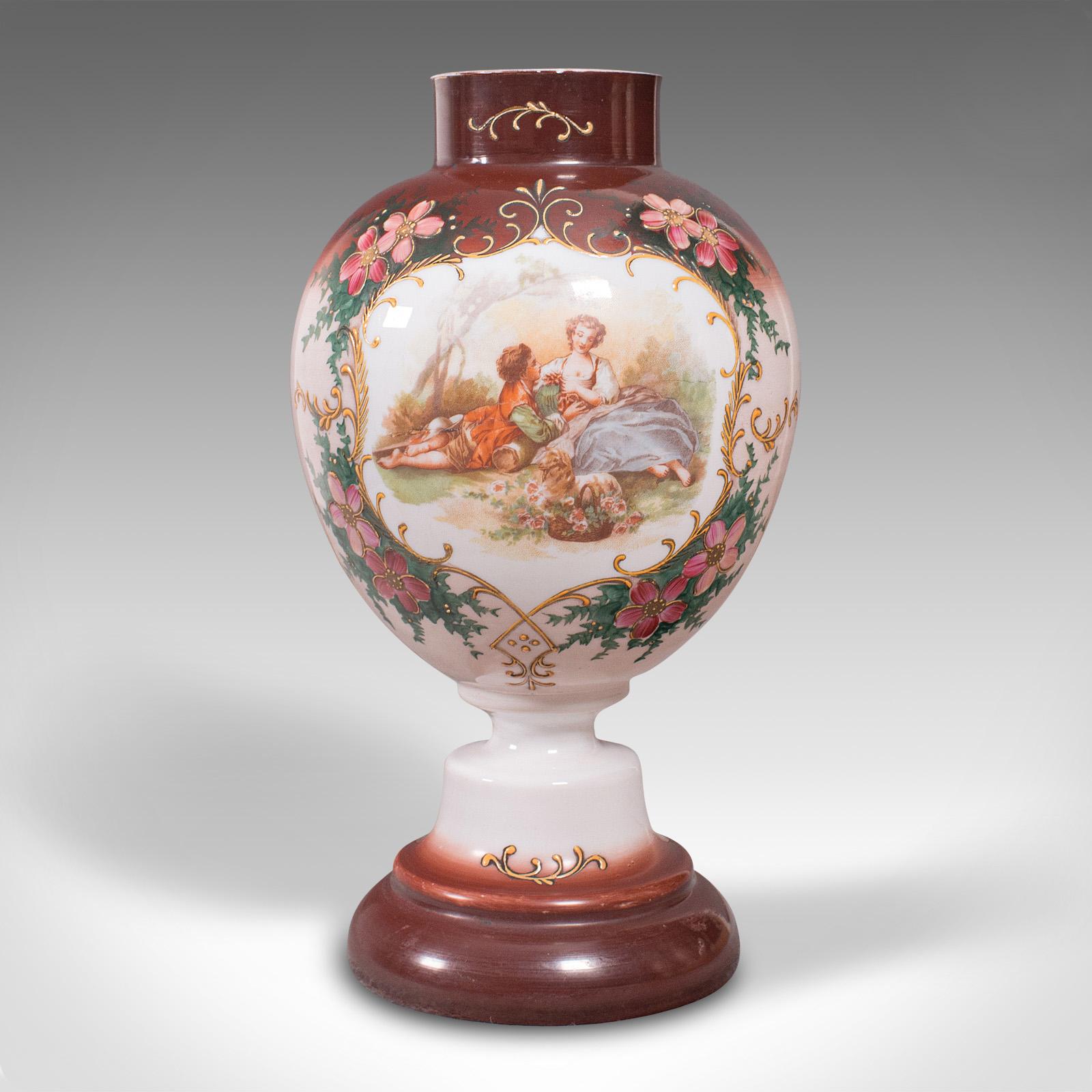 This is an antique decorative flower vase. A Continental, painted milk glass baluster urn, dating to the late Victorian period, circa 1890.

Charming aesthetic with Continental romantic taste
Displays a desirable aged patina