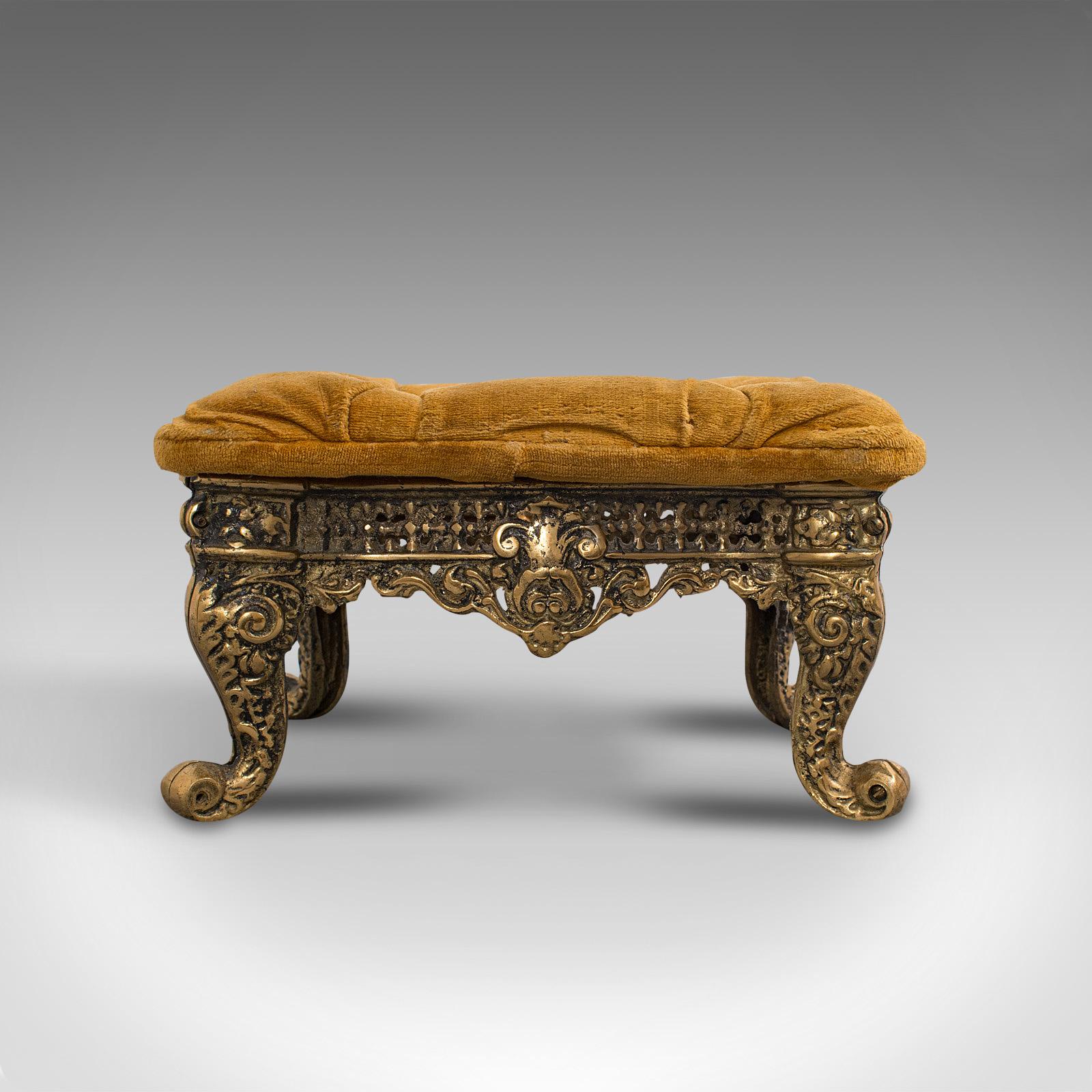 This is an antique decorative footstool. An Italian, gilt metal and textile stool in Baroque revival taste, dating to the late 19th century, circa 1900.

A quality stool of distinction and warmth
Displaying a desirable aged patina - free of marks