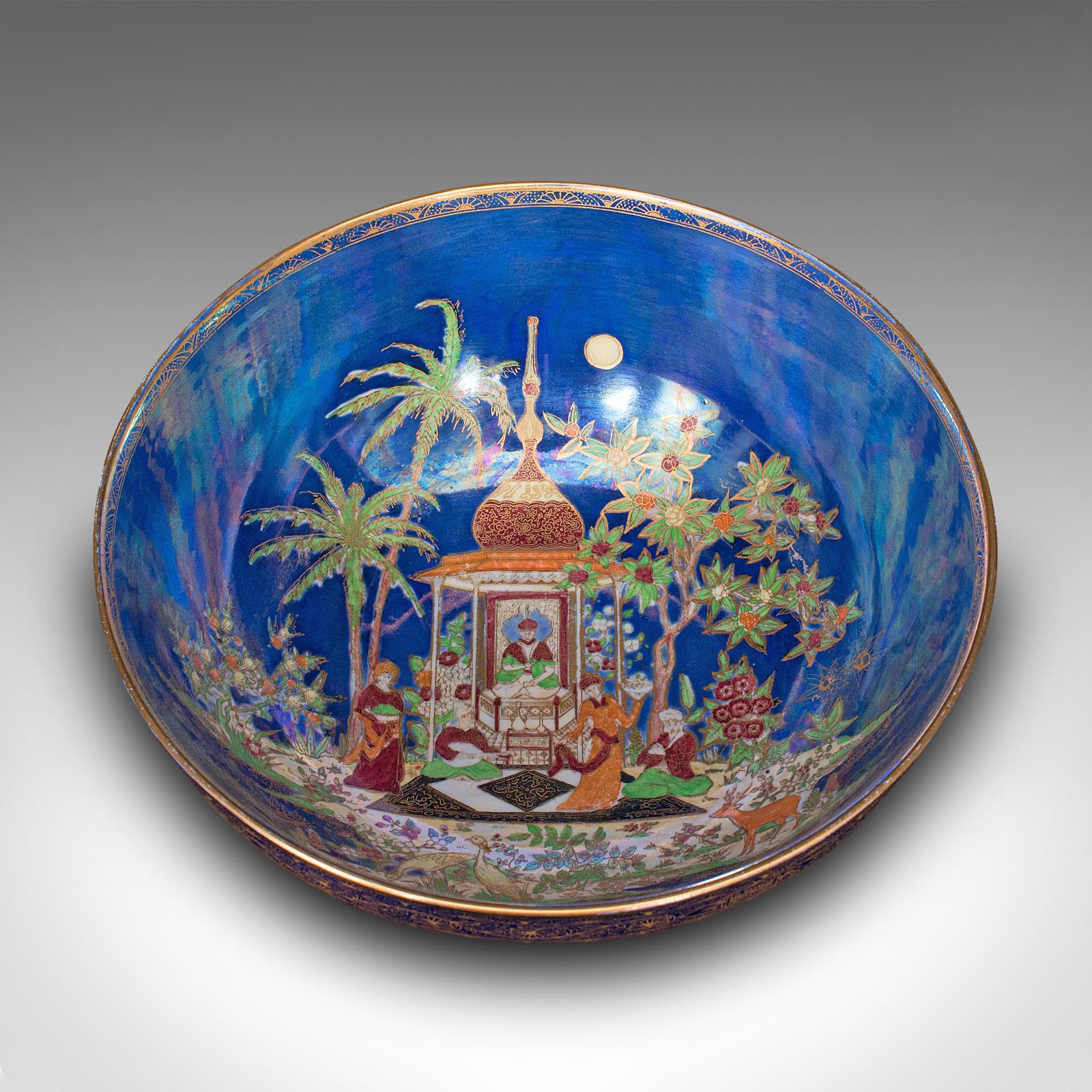 This is an antique decorative fruit bowl. An English, ceramic and lustre finish serving dish, dating to the early 20th century, circa 1920.

Striking colour and distinctive Carlton Ware Persian pattern appeal
Displays a desirable aged patina and