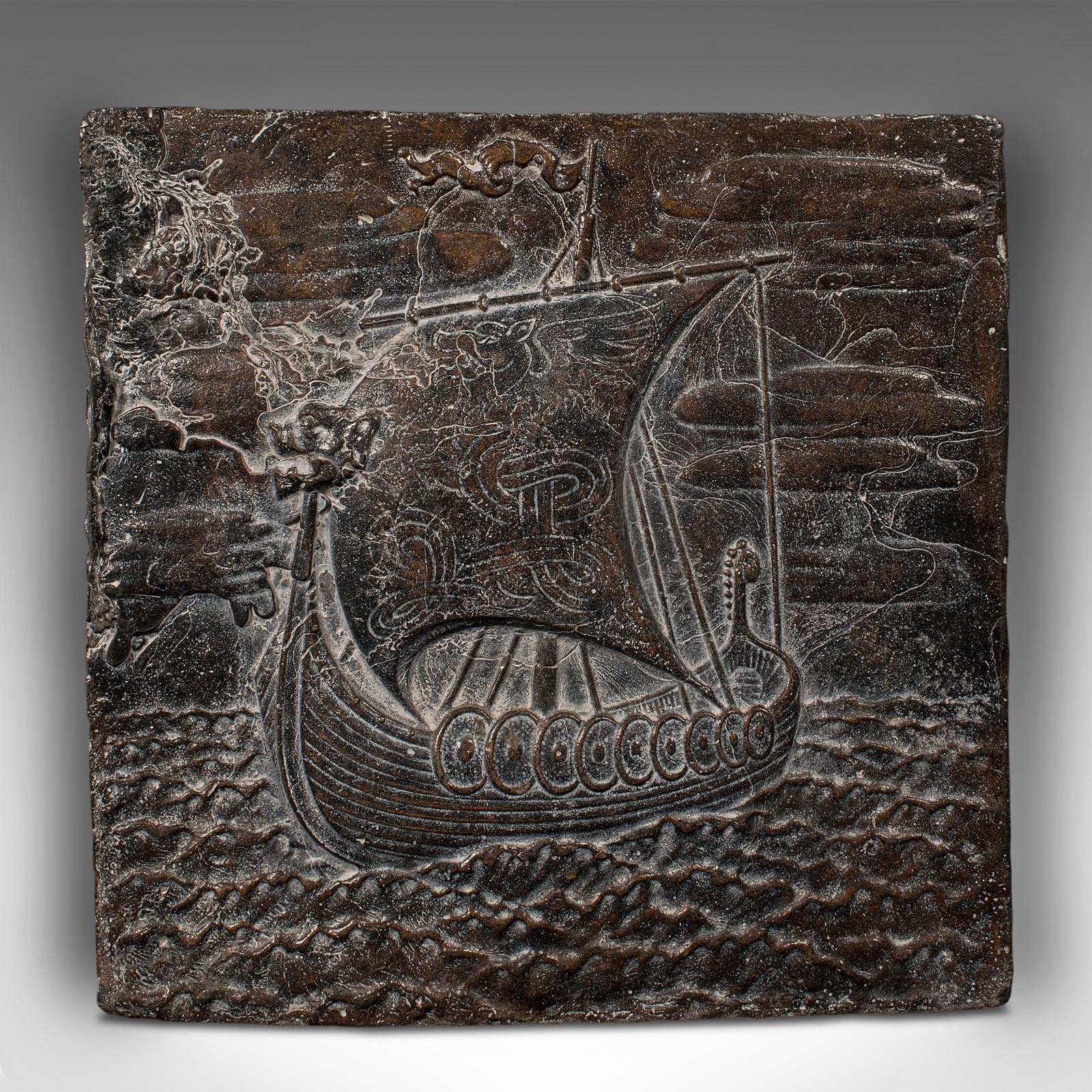 This is a heavy antique decorative lead plaque. A Scandinavian, relief panel with Viking long ship scene, dating to the Arts & Crafts movement of the late Victorian period, circa 1900.

Fascinating lead panel, with superb decorative