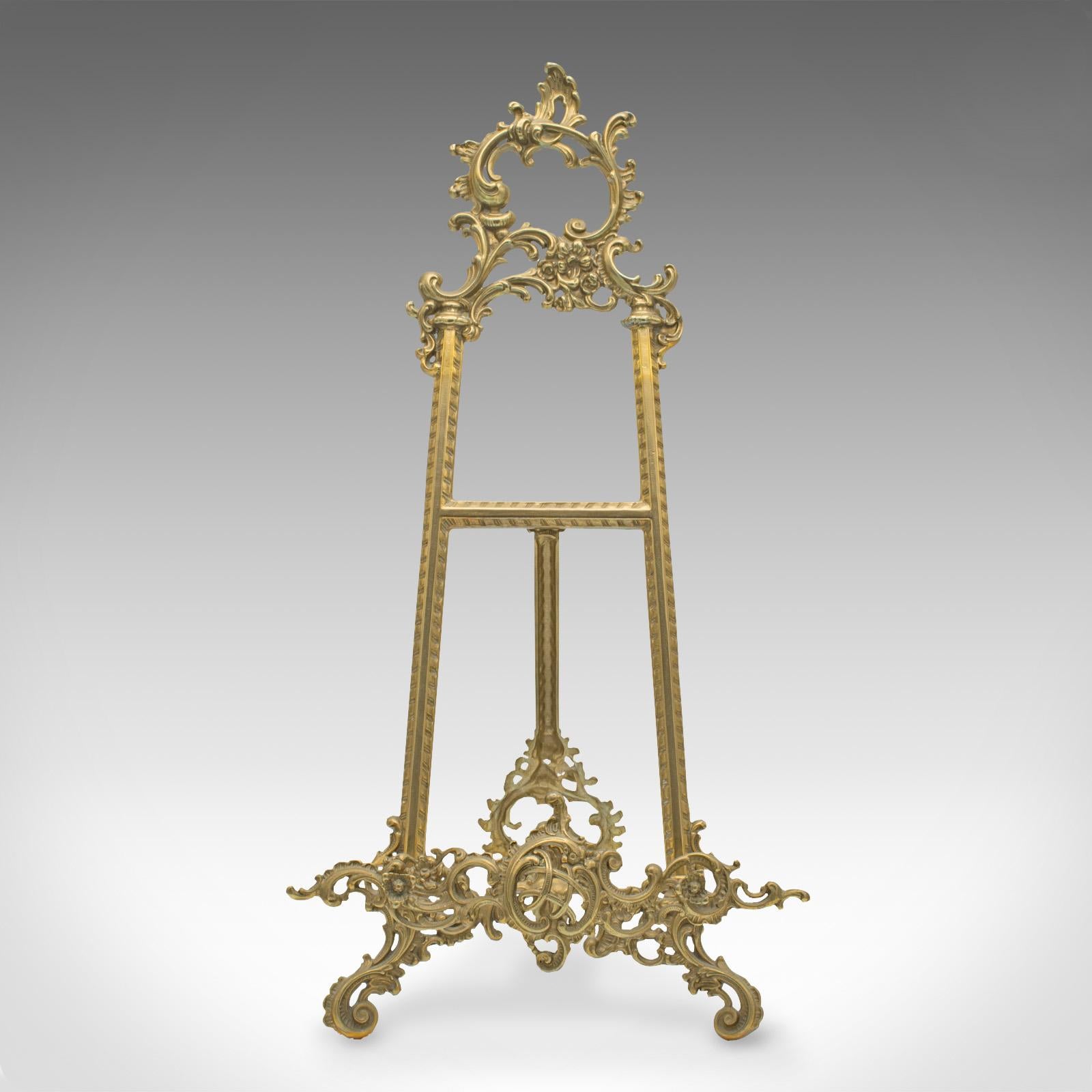 This is an antique decorative picture stand. An English, brass book rest or artist's easel in Art Nouveau taste, dating to the early 20th century, circa 1920.

Graceful and fascinating stand with a versatile purpose
Displays a desirable aged