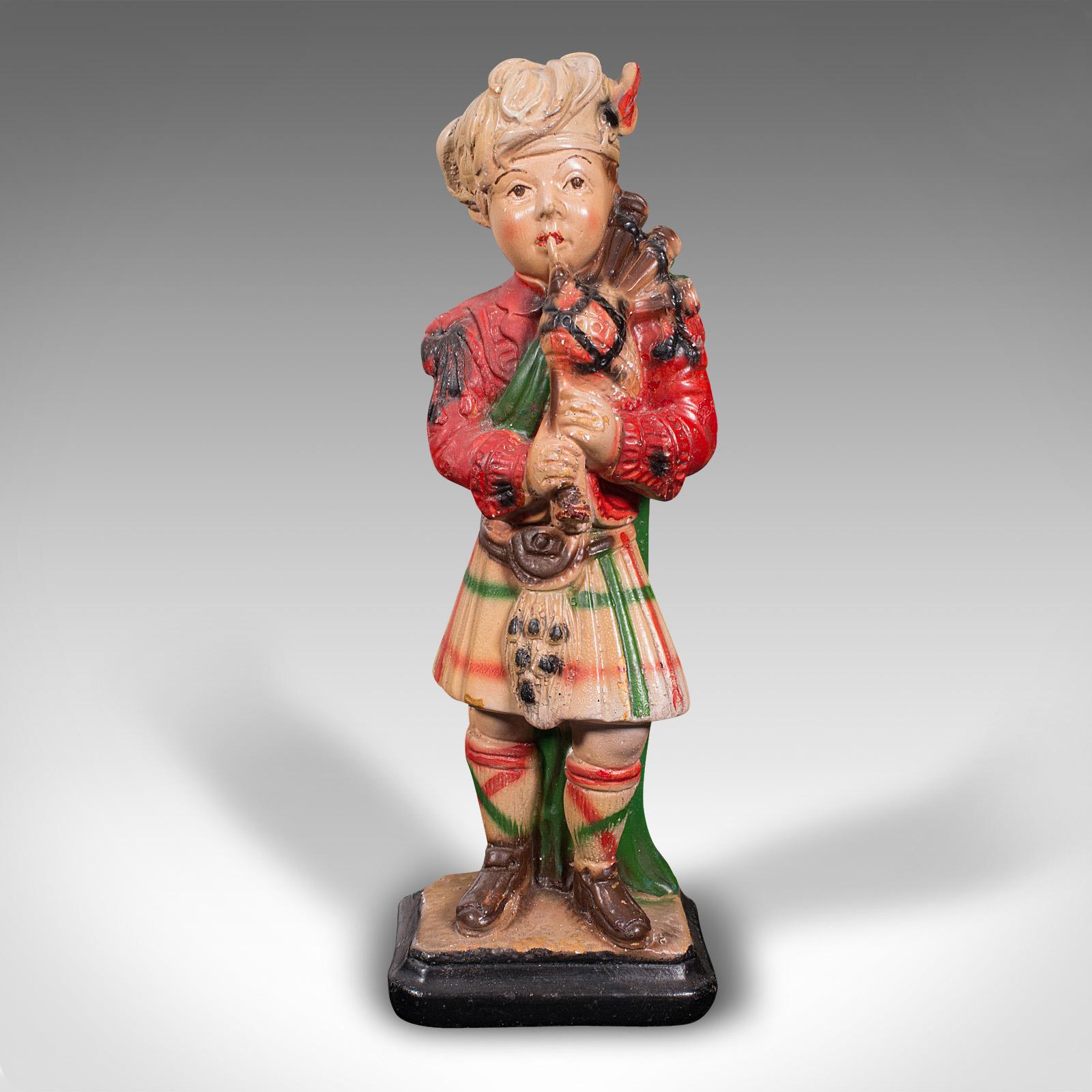 This is an antique decorative piper figure. A Scottish, plaster statue in the manner of a Scots Guard, dating to the late Victorian period, circa 1900.

Delightfully charming figure with appeal for Scots and collectors
Displays a desirable aged