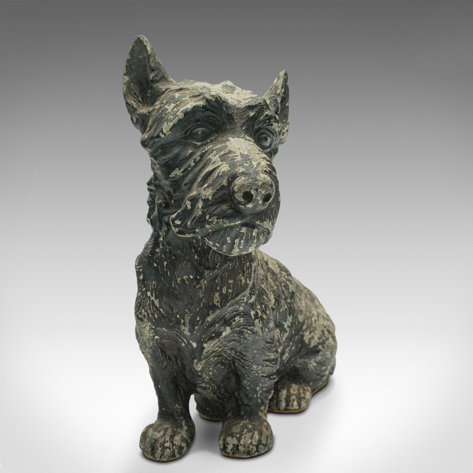 This is an antique decorative Scottish Terrier. A British, spelter ornamental Scottie dog, dating to the Edwardian period, circa 1910. 

Exudes character and appealing weathering
Displaying a desirable aged patina and in good original
