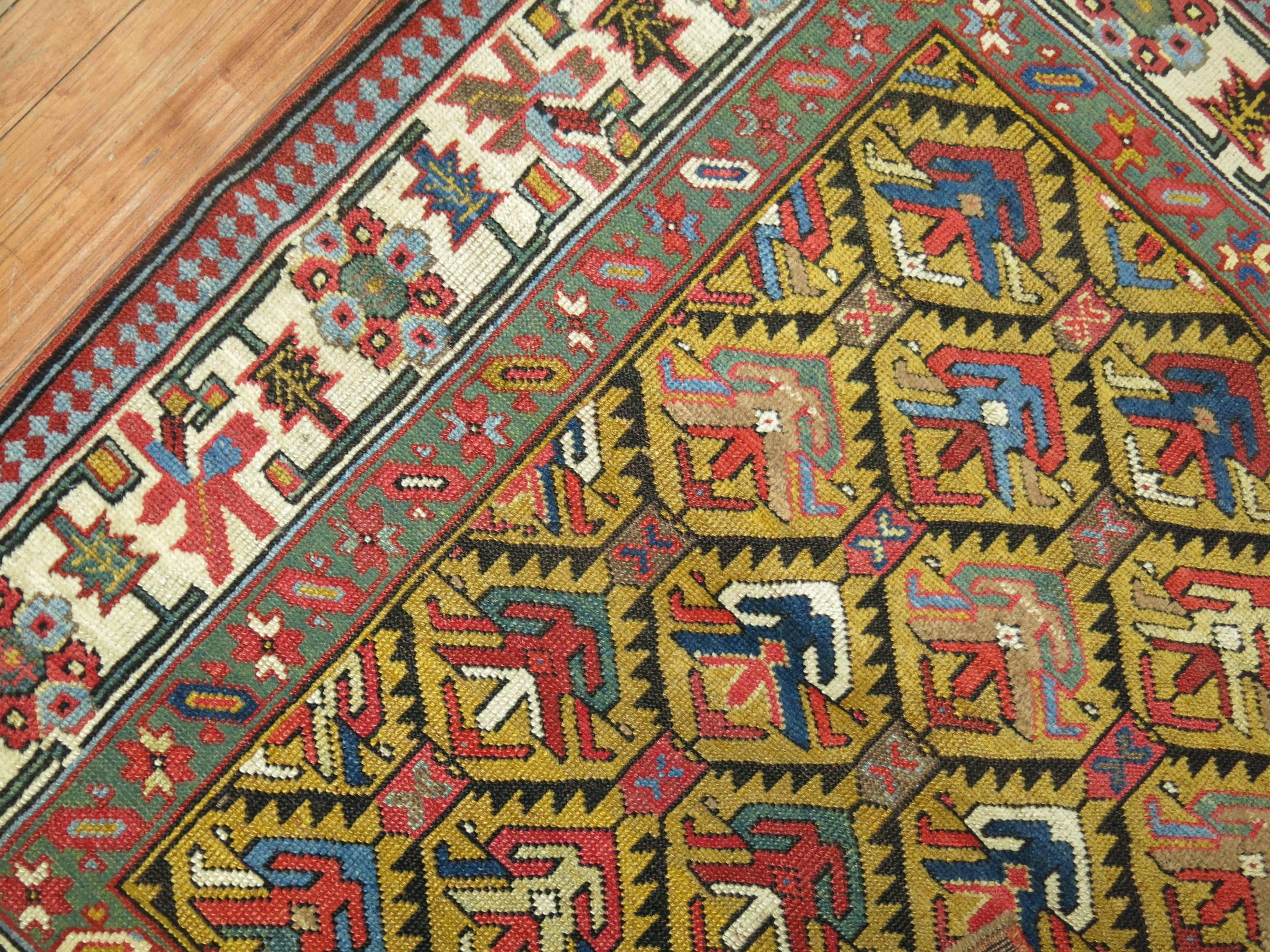 Rare size antique Caucasian Shirvan rug with a mustard ground and ivory border.

Shirvan is located to the south of the Caucasus mountain range and is to the east of Gendje and to the west of the Baku peninsula. Local weaving tradition in this