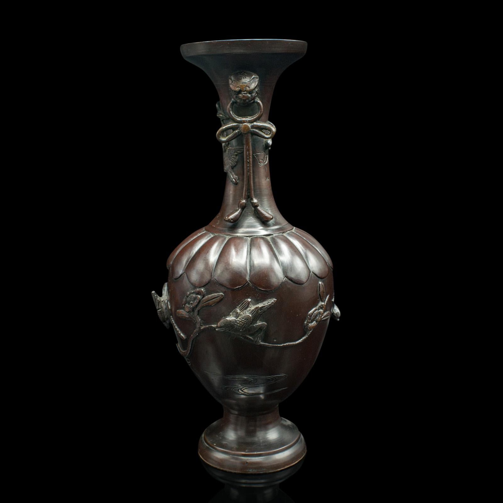 This is an antique decorative stem vase. A Japanese, bronze Meiji era baluster urn, dating to the late Victorian period, circa 1880.

Traditional baluster form with superb relief bird detail
Displaying a desirable aged patina with minimal