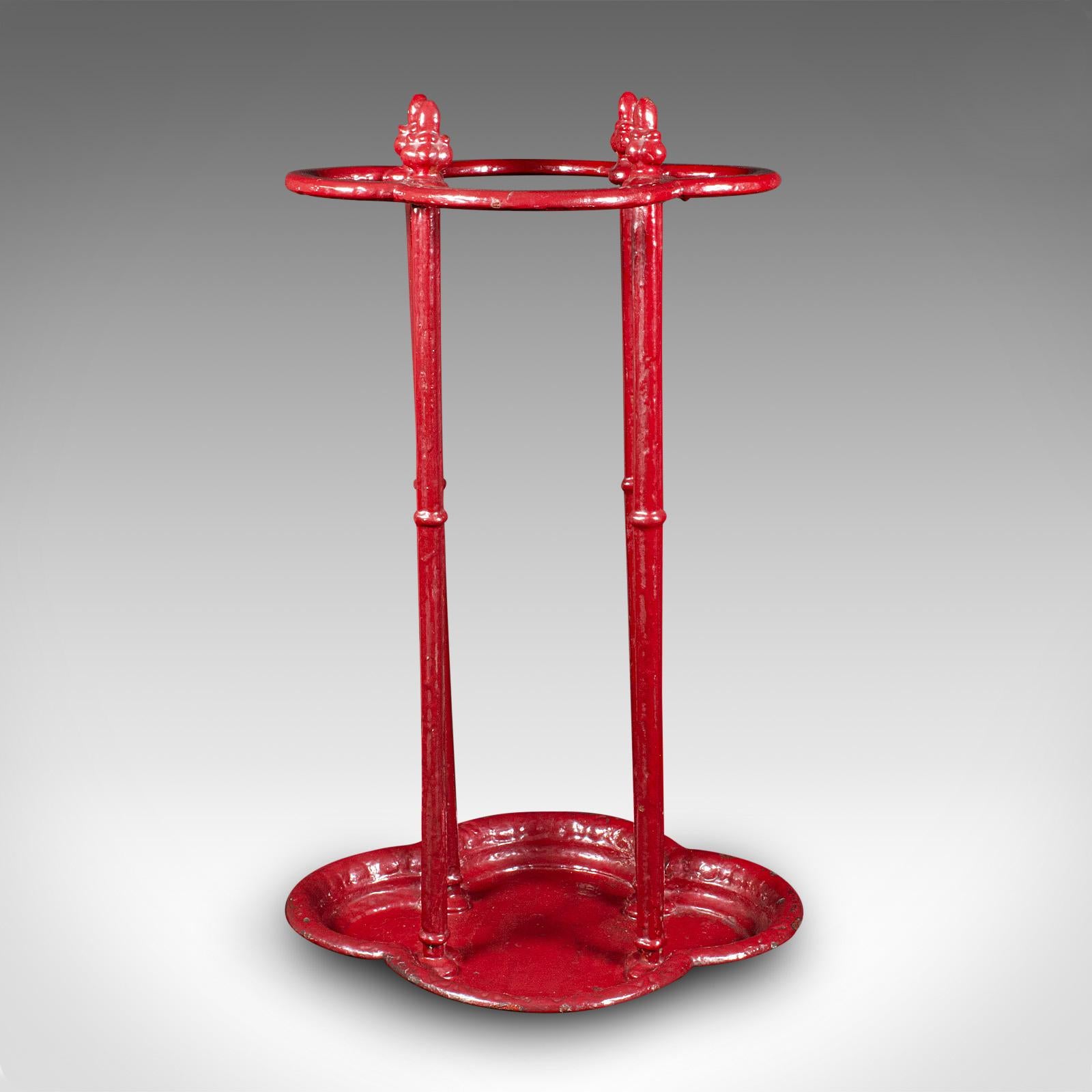 This is an antique decorative stick stand. An English, painted cast iron umbrella rack, dating to the early Victorian period, circa 1850.

Strikingly presented stand with appealing forms and finish
Displays a desirable aged patina throughout
Robust