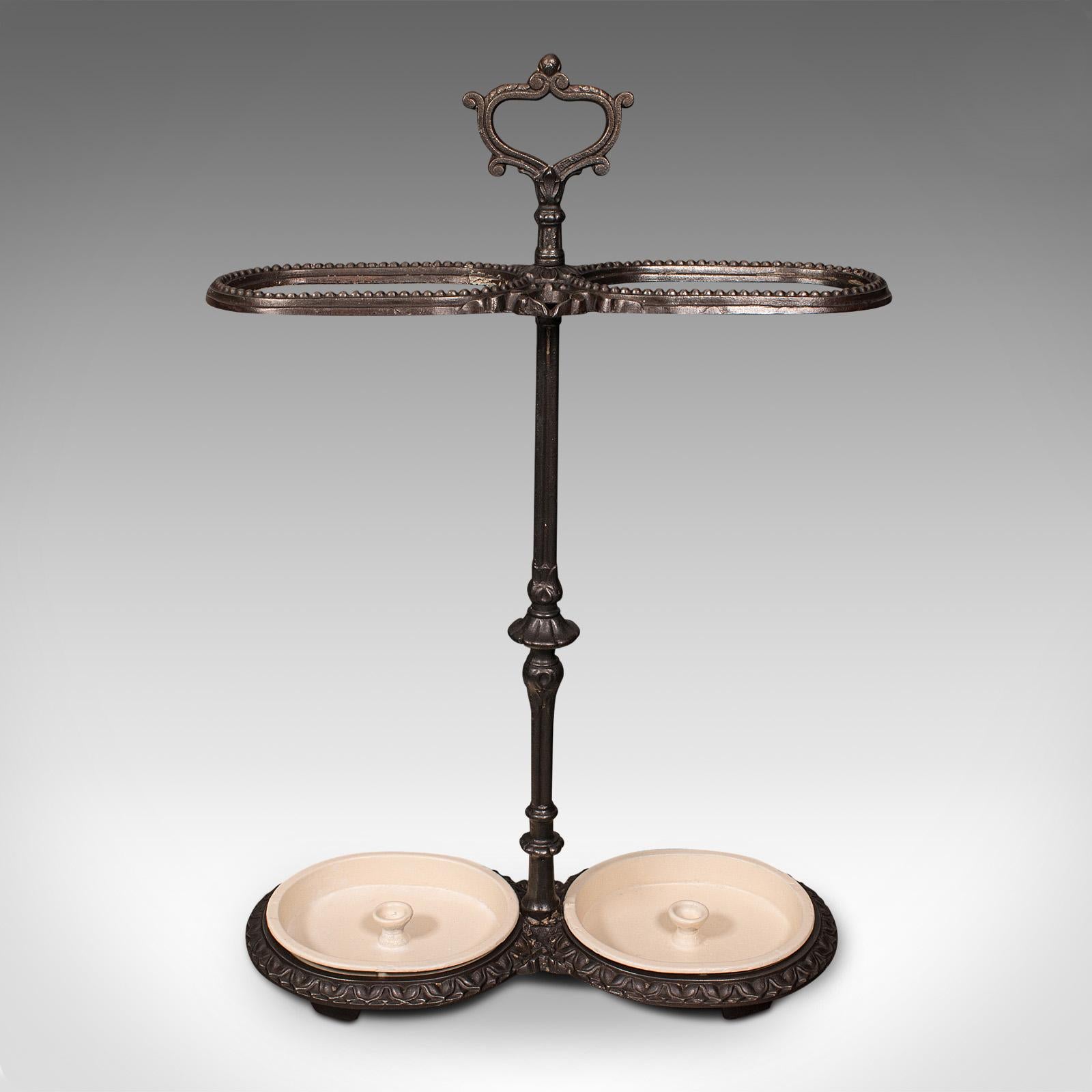This is an antique decorative stick stand. A French, cast iron hallway umbrella rack with Art Nouveau taste, dating to the late Victorian period, circa 1900.

Distinctive form and delightful detail abound
Displaying a desirable aged patina and in