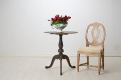 Antique Decorative Swedish Tilt-Top Table, Round Table Top and Hand-Carved Decor