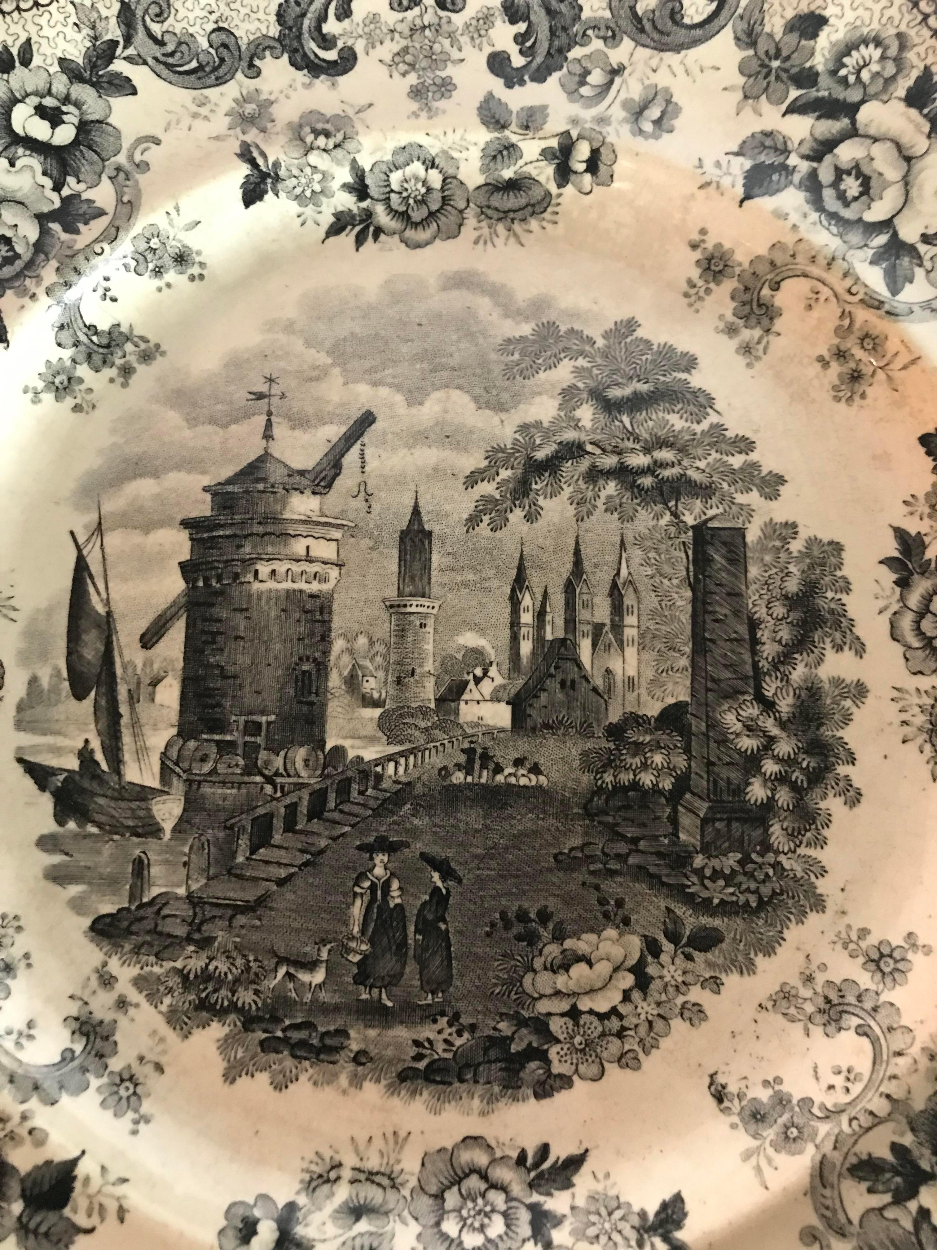 Transferware plate featuring a traditional scene. A beautiful decorative accent! Perfect for your cabinet.