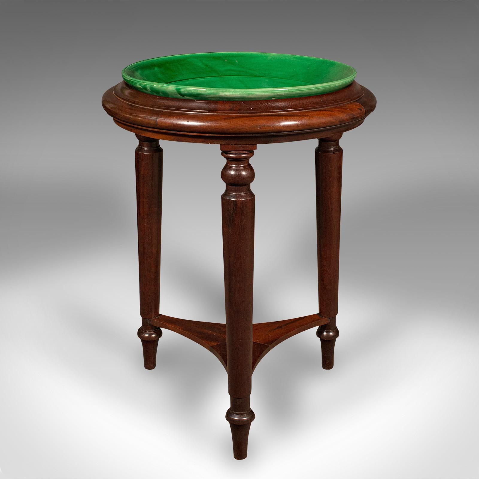 This is an antique decorative wash stand. An English, mahogany and ceramic jardiniere or planter frame, dating to the Regency period and later, circa 1820.

Charismatic and versatile with superb colour for decorative appeal
Displays a desirable
