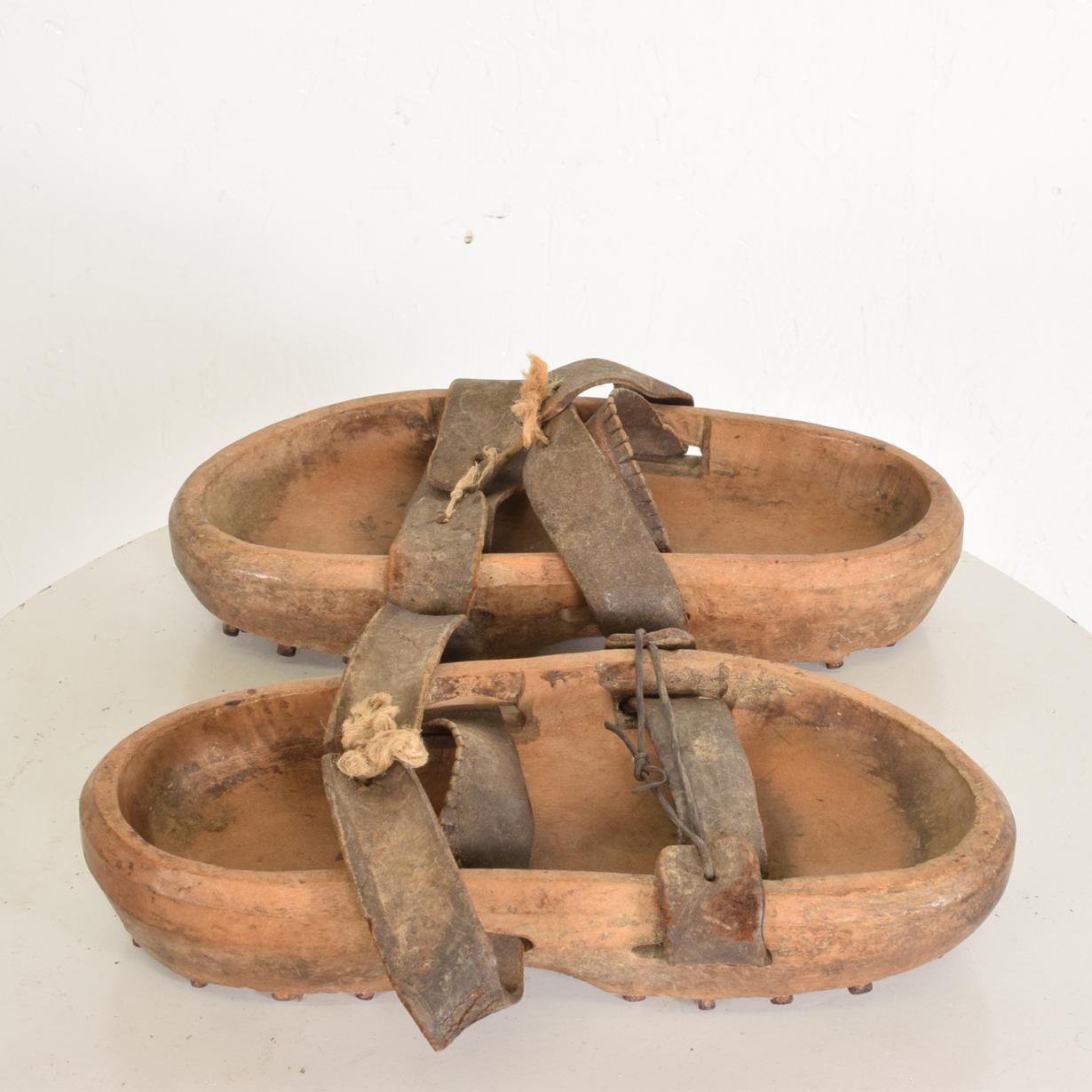 For your consideration a set of antique wood and leather shoes with metal spikes.

A beautiful character with the original unrestored condition. 

Unsigned, no information on the maker. 

Dimensions: 11 1/2