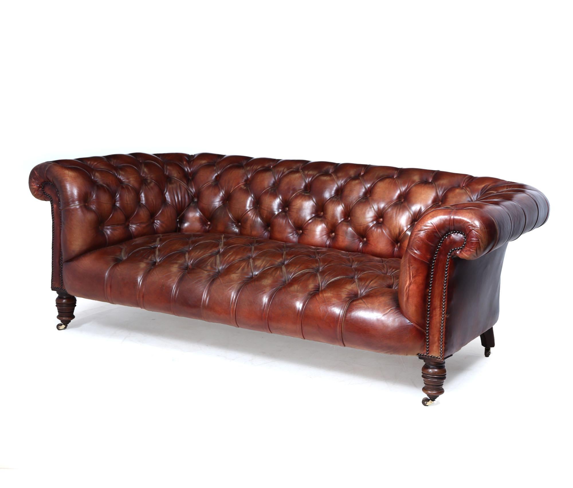 Antique Chesterfield Sofa
A beautifully proportioned late Victorian to early Edwardian Chesterfield sofa, standing on turned solid walnut legs with original ceramic castors. This deeply buttoned piece has been reupholstered to a high standard around