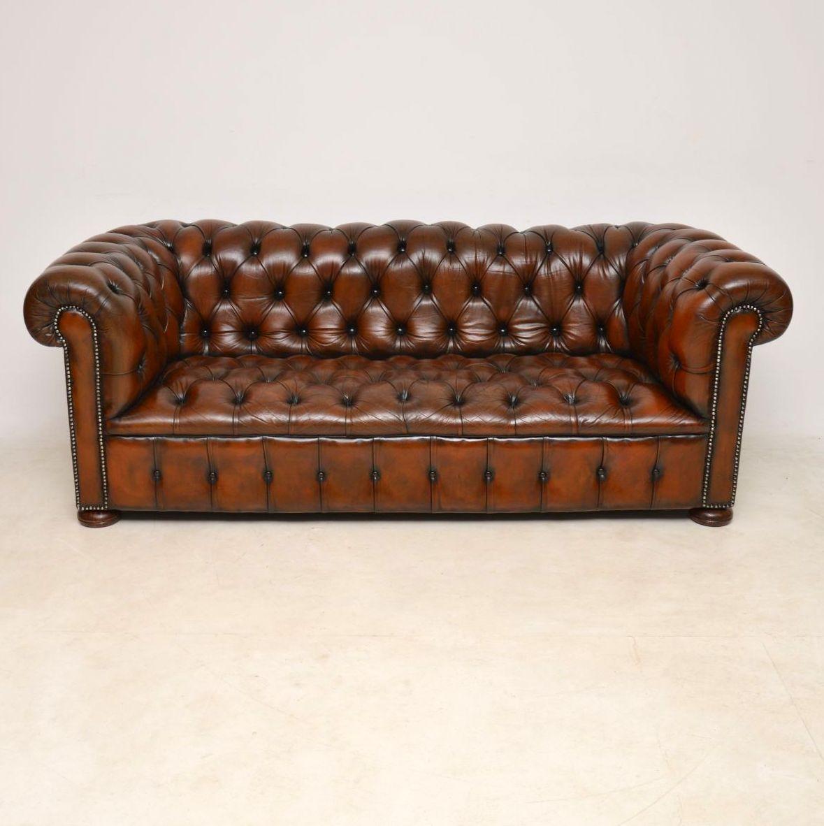 Antique deep buttoned leather Chesterfield three-seat sofa with a wonderful color and plenty of character. It's in good original condition & dates from around the 1920's period. The leather is naturally distressed and there are no rips or tears,