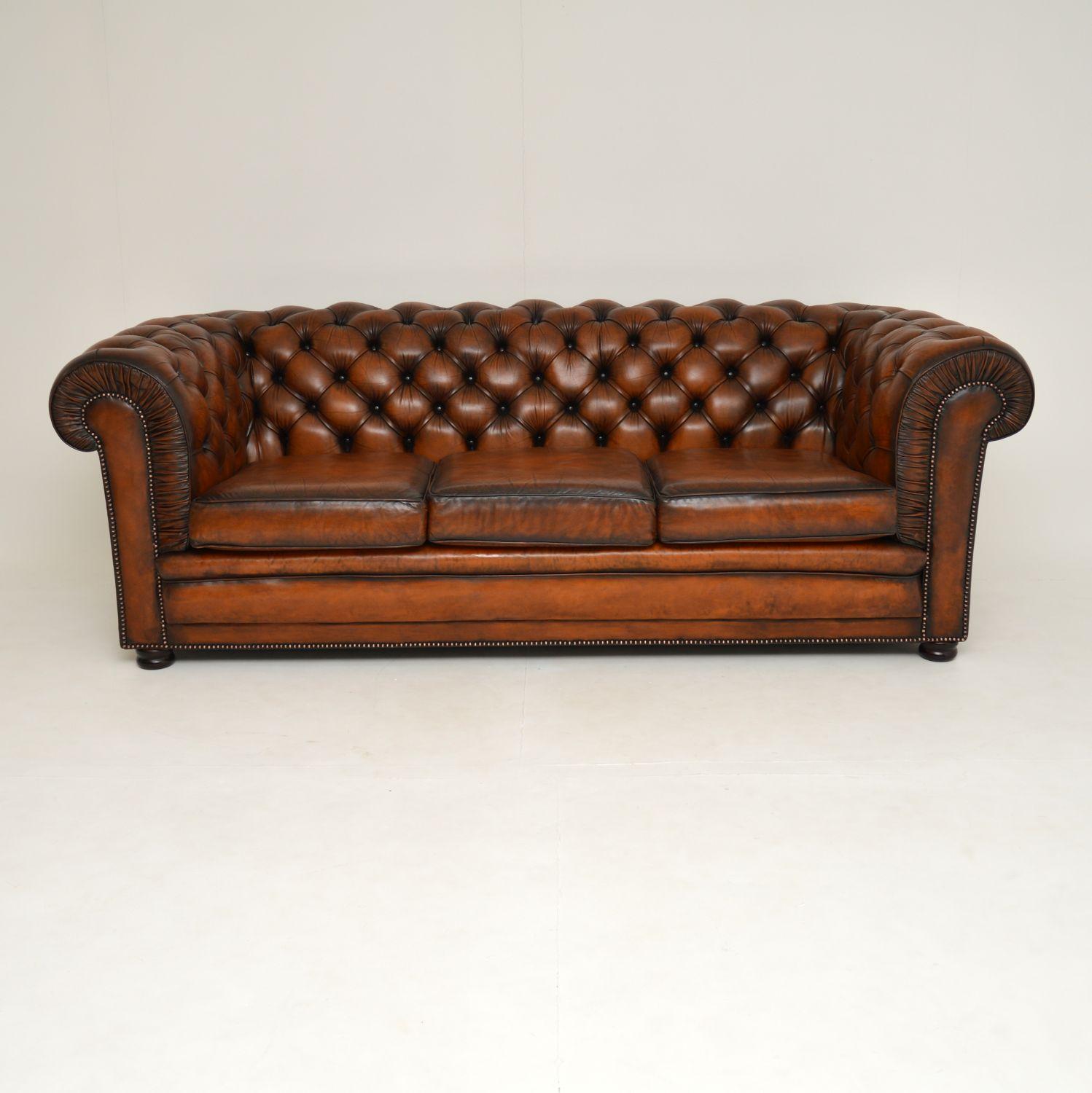 A superb vintage leather Chesterfield sofa, in the antique Victorian style. This is of excellent quality, very comfortable & I would date it to circa 1950s.

It’s upholstered in top quality leather, with a pleated front edge which adds a nice