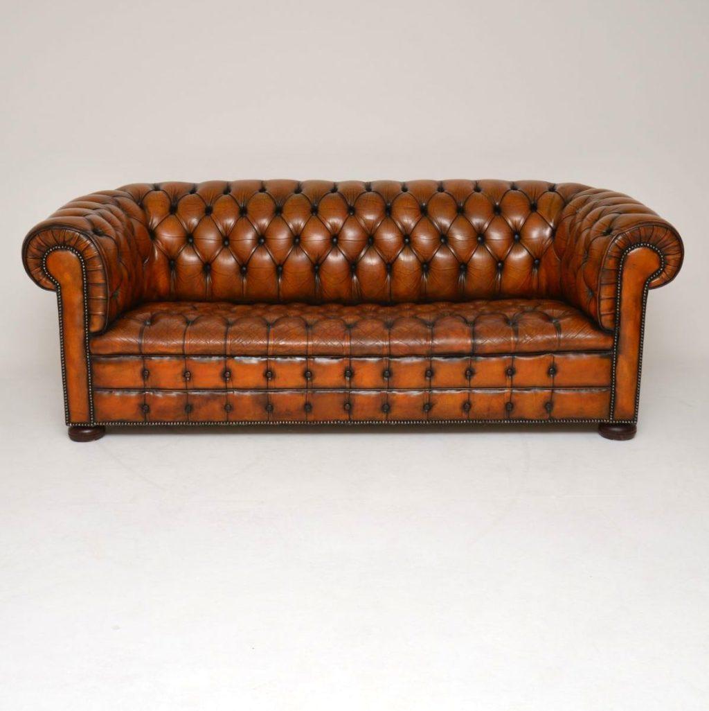 This antique deep buttoned leather three seater Chesterfield is a great looking piece of furniture & has loads of character. It’s in good original condition & naturally distressed. The leather itself is in good condition, no tears or holes & is