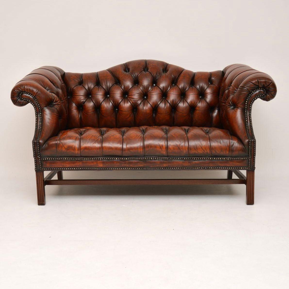 This antique sofa still has the original deep buttoned leather upholstery, which is in very good original condition. The color is magnificent & it has loads of character. We have just had it revived & polished by our leather specialist. Its
