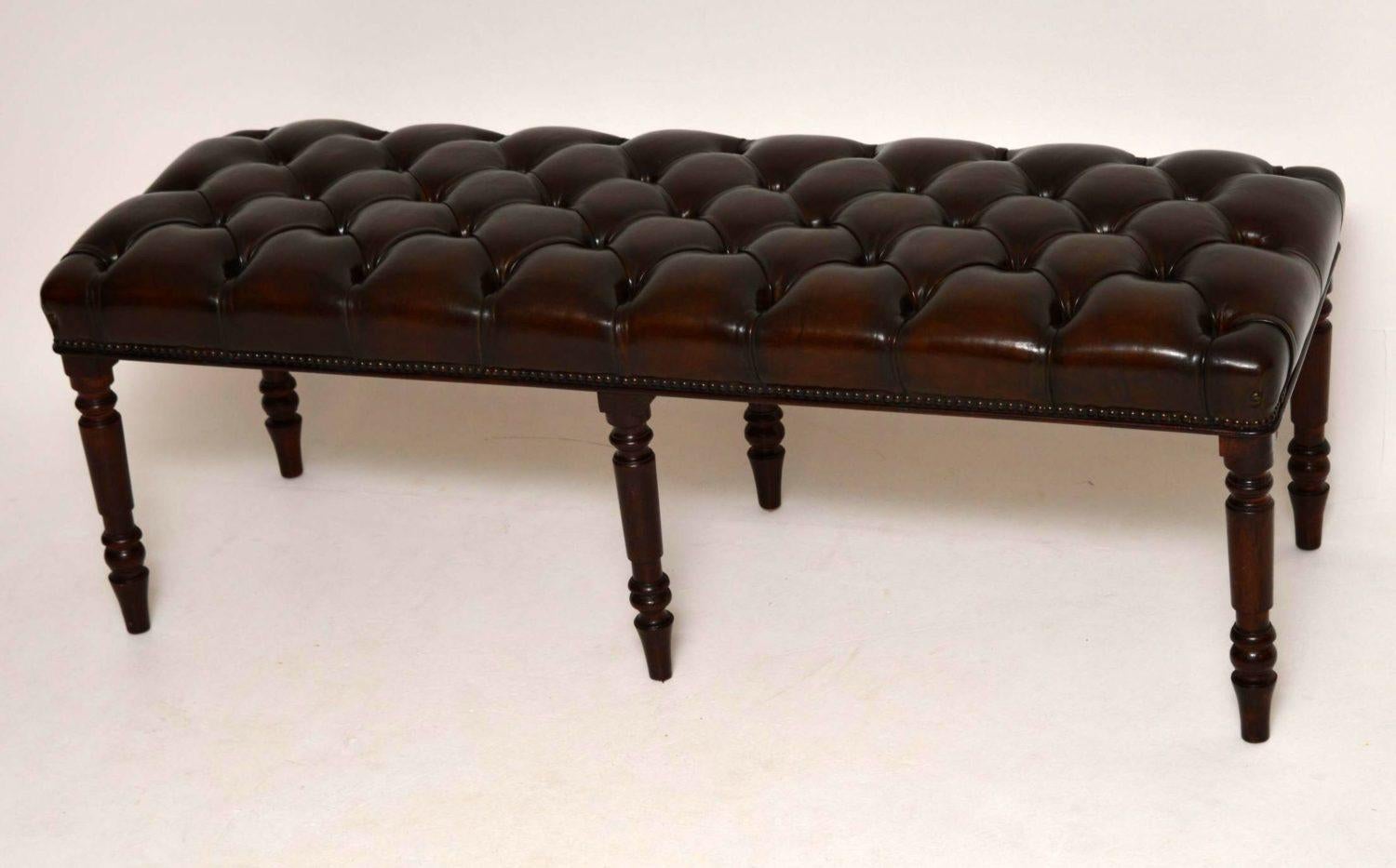 Antique deep buttoned leather upholstered stool on a mahogany frame with six turned mahogany legs. This stool has some age, but I believe it’s been adapted. The leather seat which has lots of character is deep buttoned and hand tacked onto the
