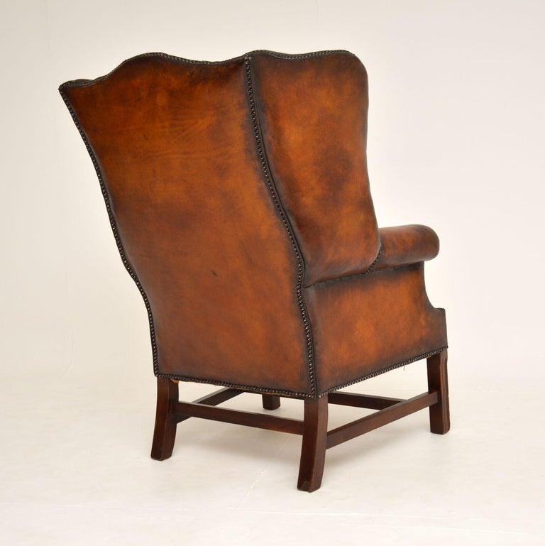Antique Deep Buttoned Leather Wing Back Armchair For Sale 4