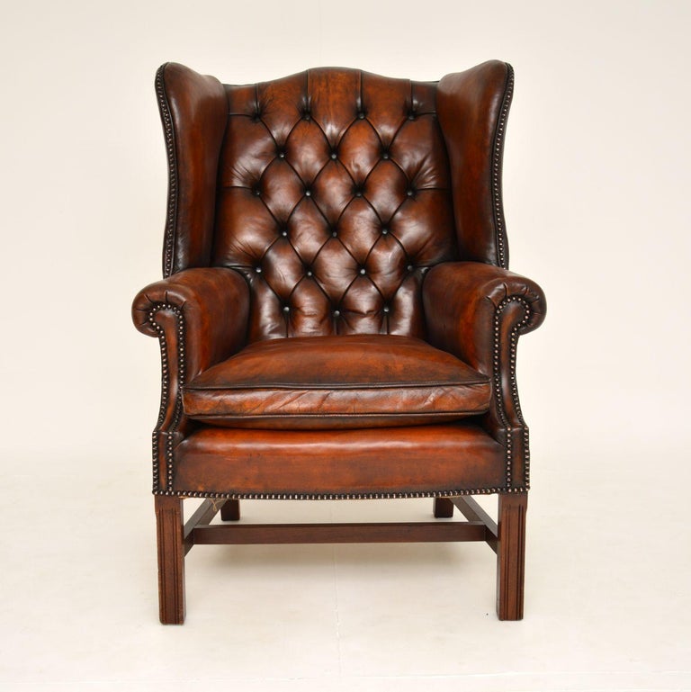 A fantastic looking and extremely comfortable antique deep buttoned leather wing chair. This was made in England, it dates from around the 1930’s.
The quality is superb, the leather has a gorgeous colour tone and the frame has a wonderful and