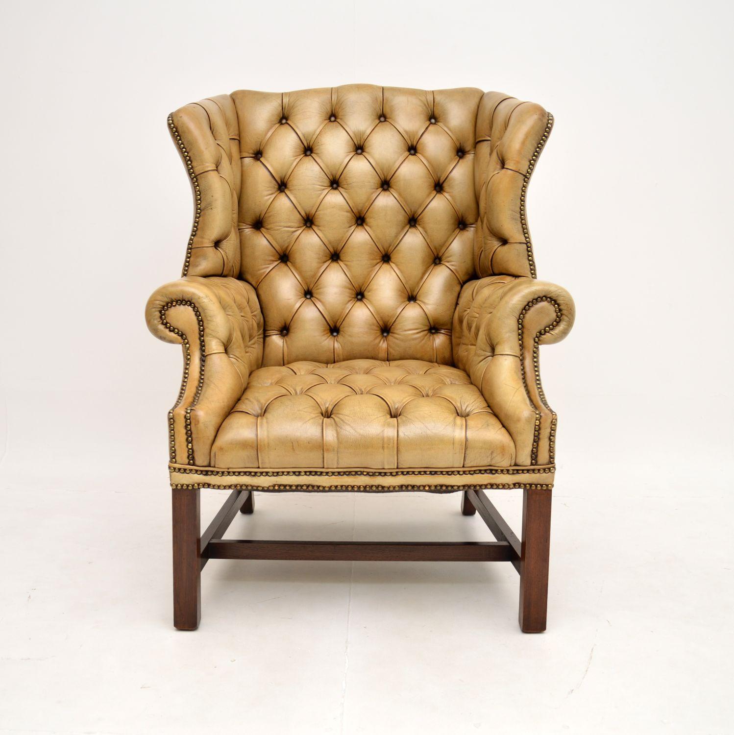 An exceptional antique deep buttoned leather wing back armchair. This was made in England, it dates from around the 1920-30’s.

It is of superb quality, one of the finest examples you could find. It is large and of generous proportions, it is also
