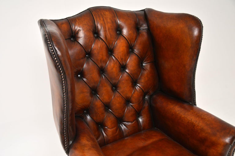 20th Century Antique Deep Buttoned Leather Wing Back Armchair For Sale