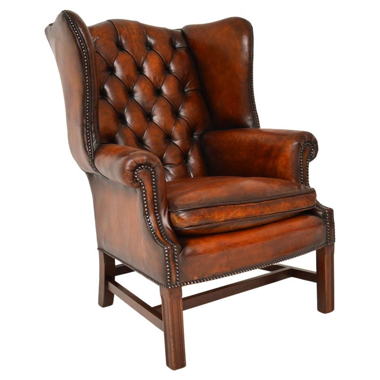 Antique Deep Buttoned Leather Wing Back Armchair For Sale