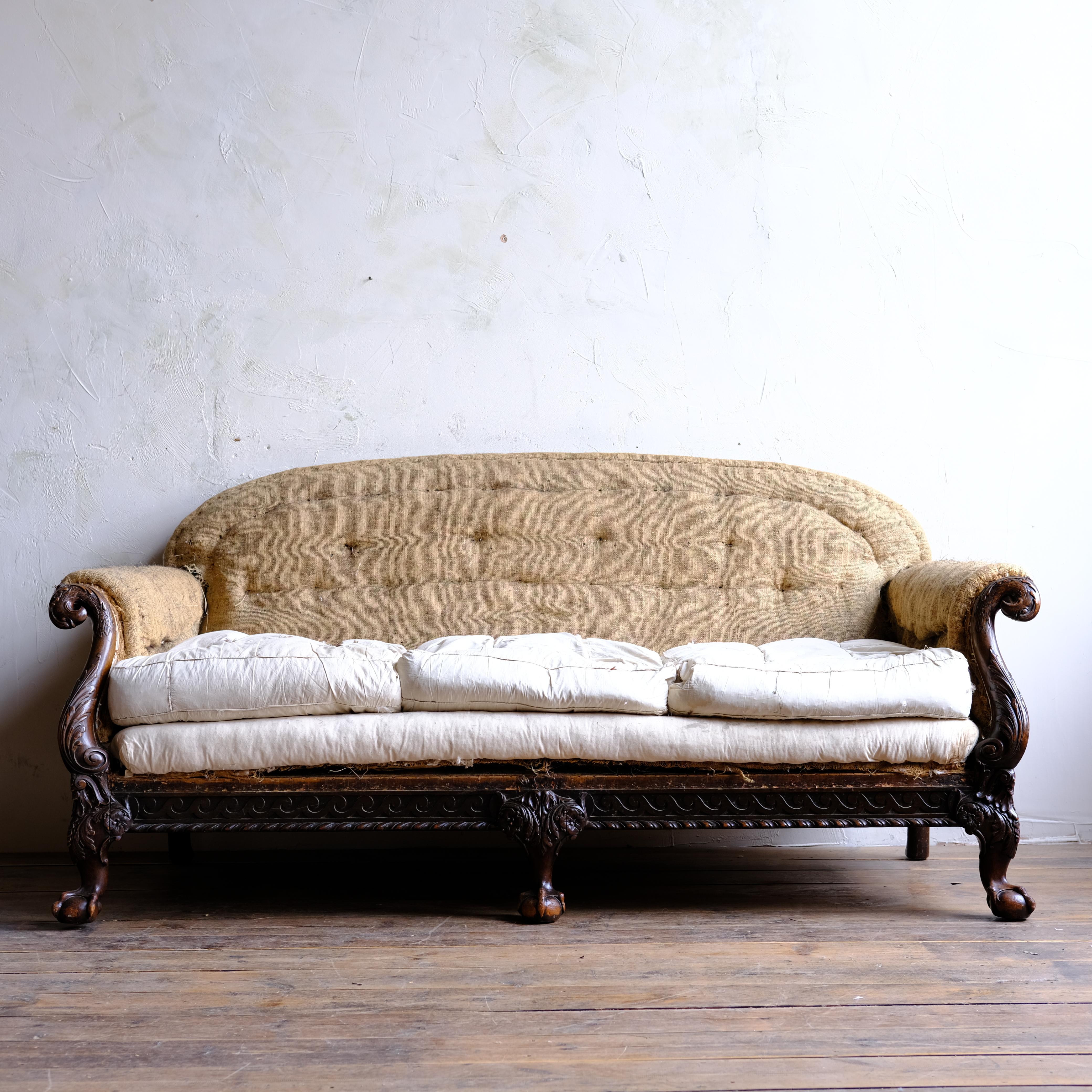 A large deep seated country house sofa with finely carved ball and claw legs and eagle heads adorning each side. Good looking from all angles. c1900

For upholstery. We do offer upholstery should you wish

185cm wide
95cm deep
85cm high.