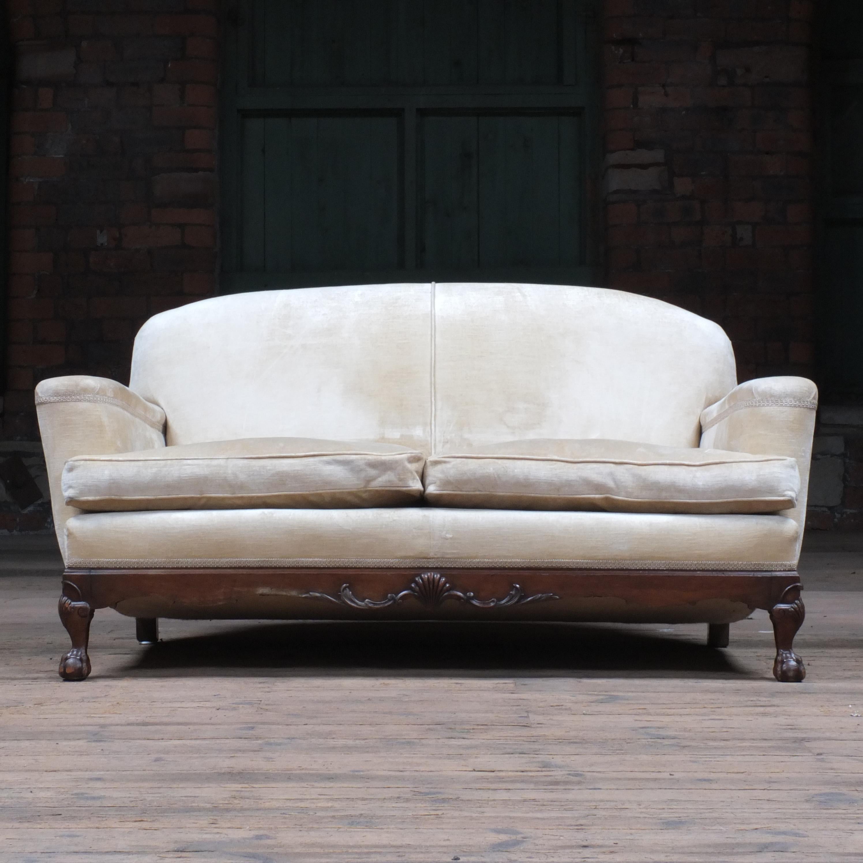A good quality walnut 2 seater sofa. The downward slope of the arms and seat topped with the feather filled cushions and horse hair interior make this a very comfortably sofa. The opulent off white velvet upholstery is in good clean order and very