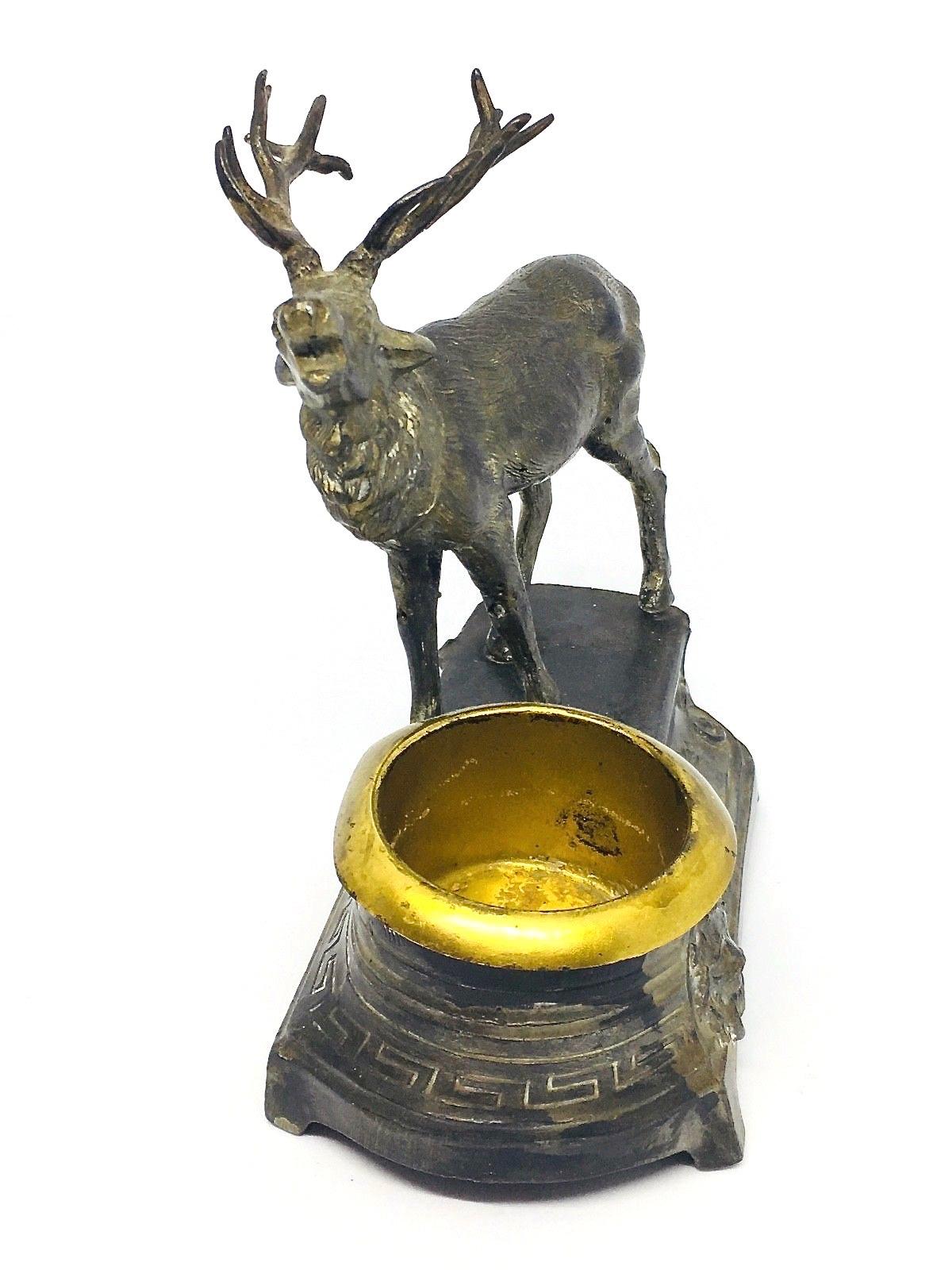 Gorgeous Austrian 1900s deer figurine on a base. Has a compartment to stow some stuff. It is marked with a number. Not signed.