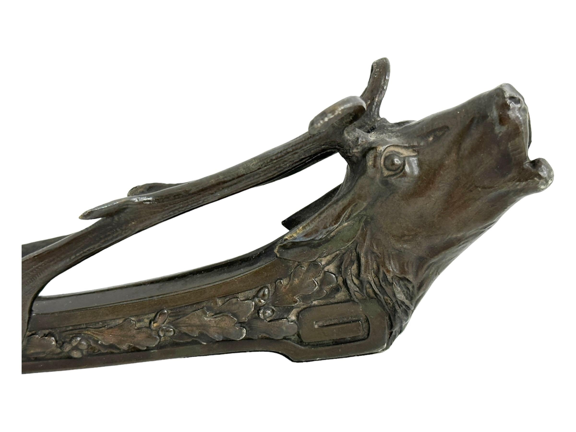 Classic early 1900s or older Metal Cigar Cutter. Beautiful large size cigar cutter in the form of a deer head. Found at an estate sale in Vienna, Austria. It has its all original antique patina. 
A beautiful item for your collection of cigar cutters