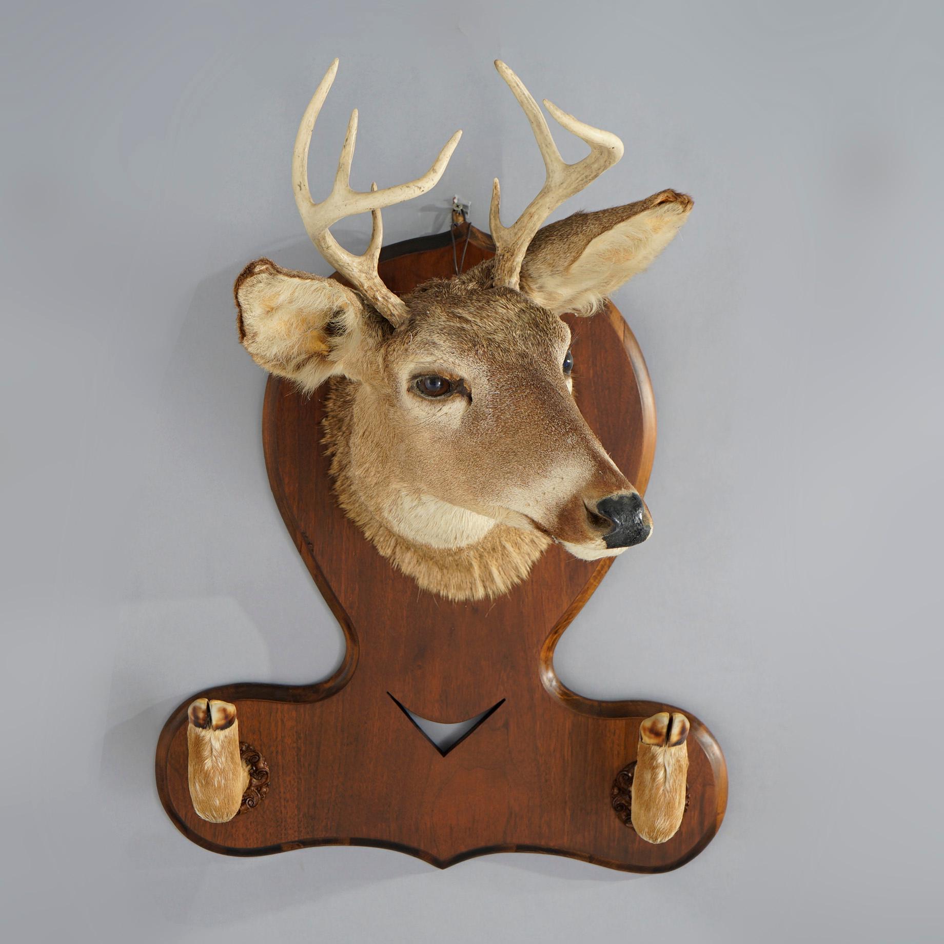 An antique hat rack offers deer mount on wood backboard, c1930

Measures- 29.25''H x 22''W x 19''D.

Catalogue Note: Ask about DISCOUNTED DELIVERY RATES available to most regions within 1,500 miles of New York.