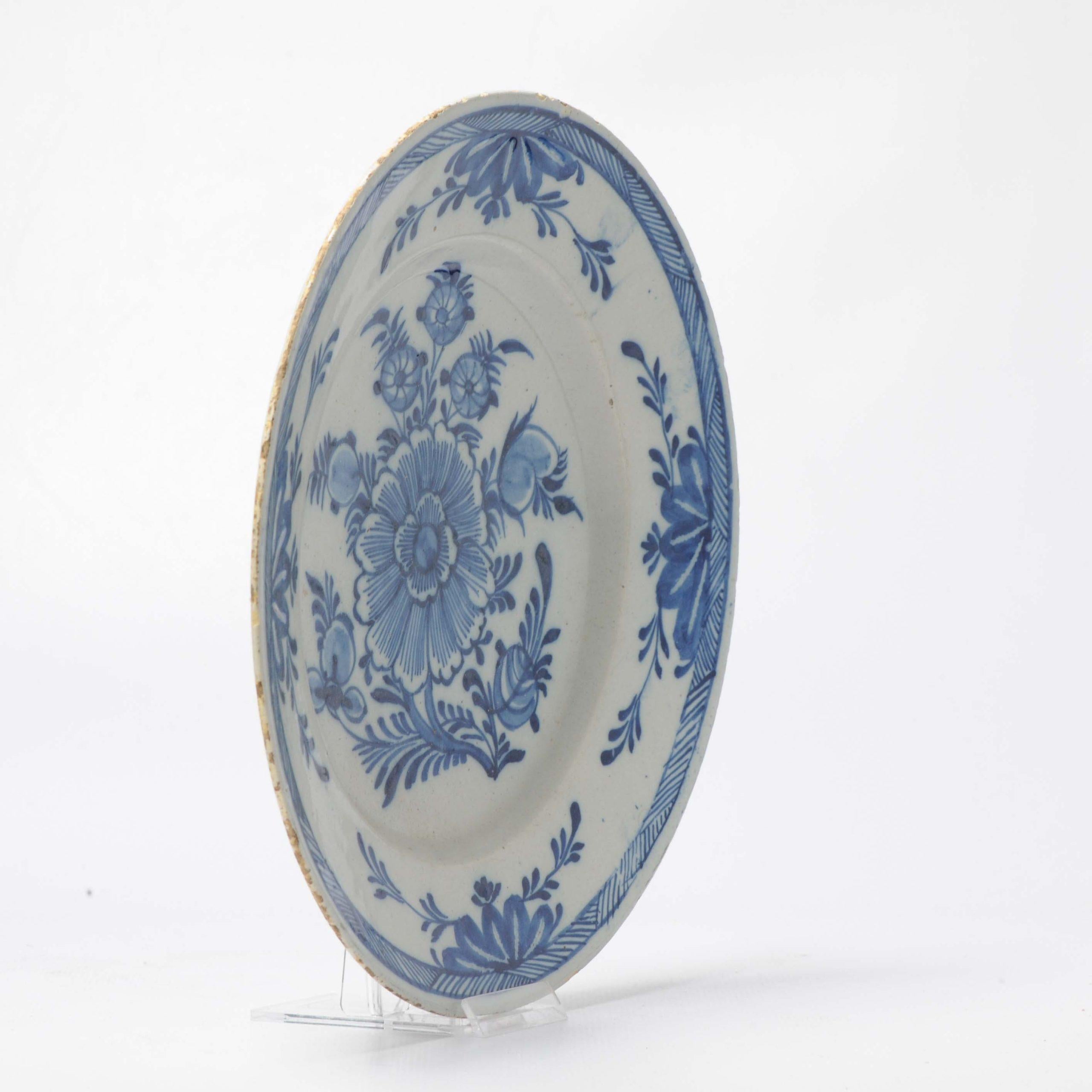 A very nicely decorated plate with central. scene of a flower.

Additional information:
Material: Porcelain & Pottery
Type: Plates
Color: Blue & White
Region of Origin: China
Period: 18th century Qing (1661 - 1912)
Age: Pre-1800
Condition: Gritting