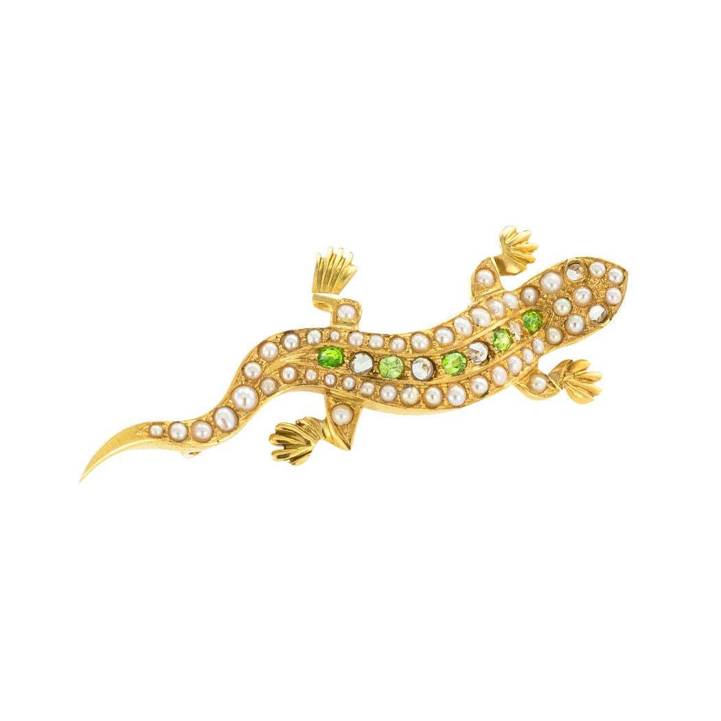 Antique demantoid garnets rose-cut diamonds pearls and yellow gold salamander brooch circa 1900. *

SPECIFICATIONS:

GEMSTONES:  seven demantoid garnets set between pearls.
DIAMONDS:  five rose-cut diamonds.

METAL:  18-karat yellow gold.

WEIGHT: 
