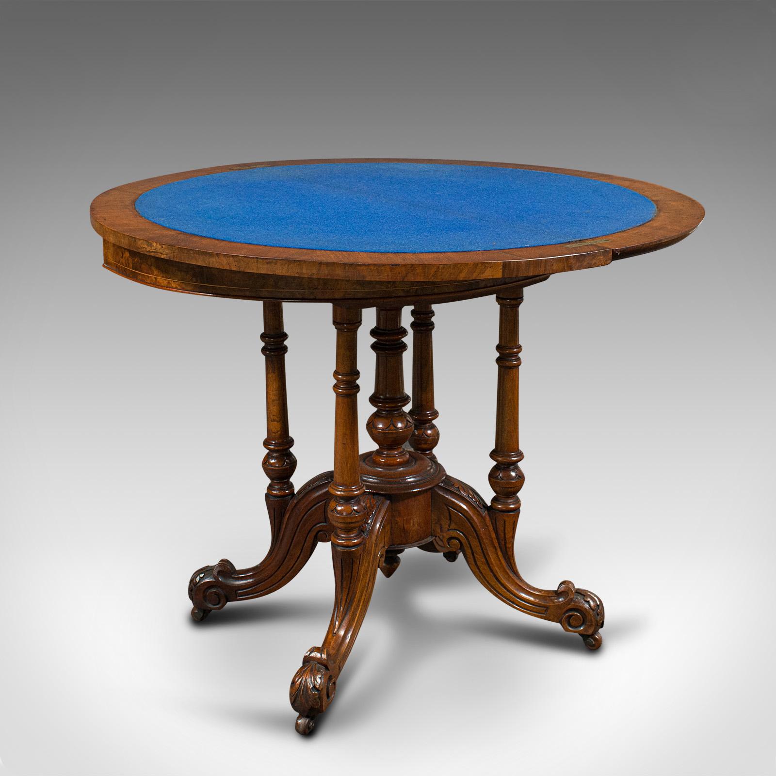This is an antique demi-lune folding card table. An English, walnut and amboyna half-round games or side table, dating to the early Victorian period, circa 1850.

Striking and exceptional, a treat for any drawing room or club lounge
Displays a