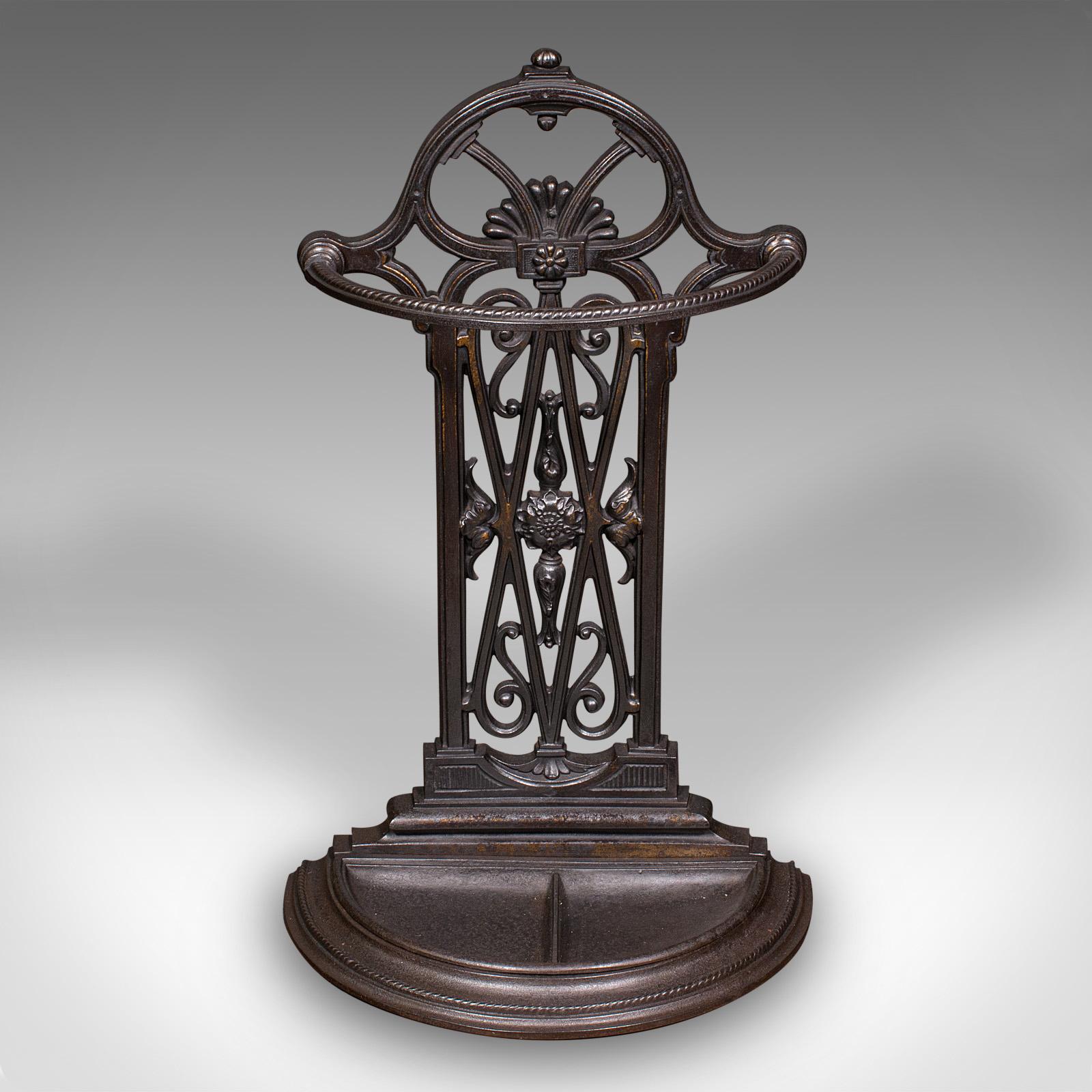 This is an antique demi-lune umbrella rack. An English, cast iron hallway stand, dating to the late Victorian period, circa 1900.

Grand appearance for this fine entrance hall stand
Displaying a desirable aged patina and in good order
Quality