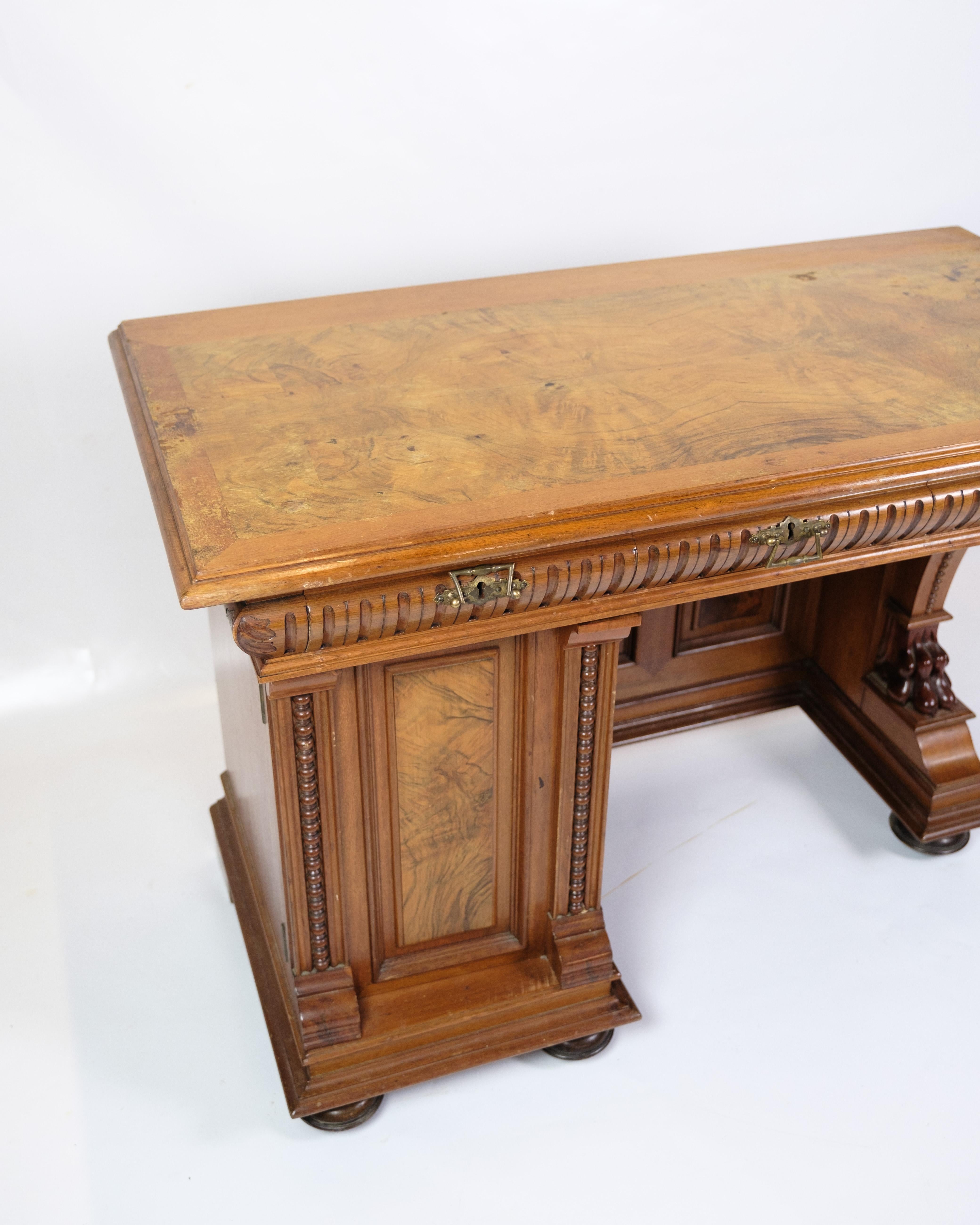 Antique desk with a small side cabinet for storage, made in walnut from the 1860s.

In very nice condition.

Dimensions: H:74.5cm W:104cm D:53cm