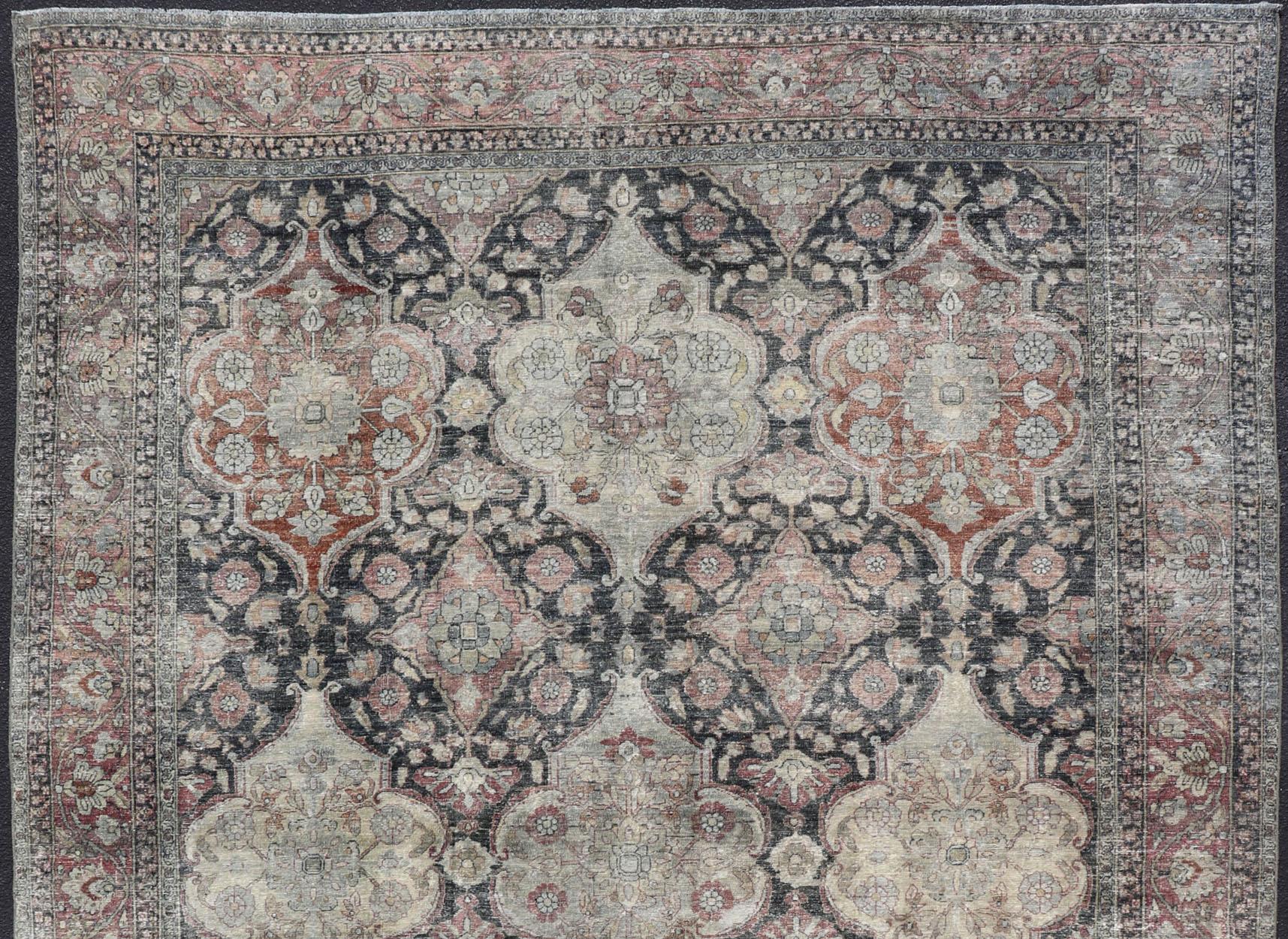 Distressed Persian antique Yazd carpet with geometric and floral design, rug R20-0703, country of origin / type: Iran / Tabriz, circa 1910

This antique Persian Yazd carpet (circa 1910) features a refined palate of various shades of Charcoal, warm