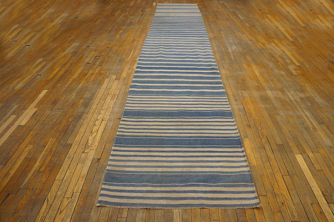 Wide blue stripes, skinny blue stripes, white ones in between, all run fully across this antique, long all-cotton antique Indian flat-woven runner (kenare). Can be shortened, but not widened. Good condition. Measures: 3'8