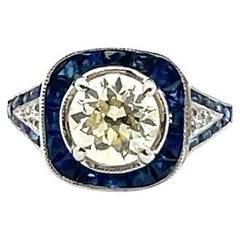 Anillo de Platino con Diamante Antiguo de 1,50 quilates y Zafiro Azul de 2,00 quilates