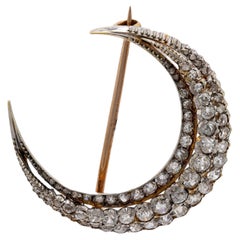 Antique diamond 18k yellow gold and silver crescent brooch