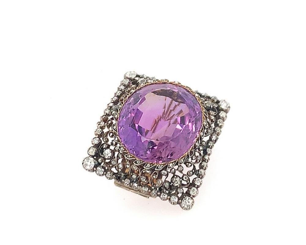 Silver top gold back diamond and oval amethyst pin, amethyst meausres 21 mm x 24.8 mm weight approx. 36.00 cts, old mine and rosre cut diamonds throughout the pin weighing approx. 1.5 cts. minor damage single pin stem. pin measures 1 3/8 x 1 1/4