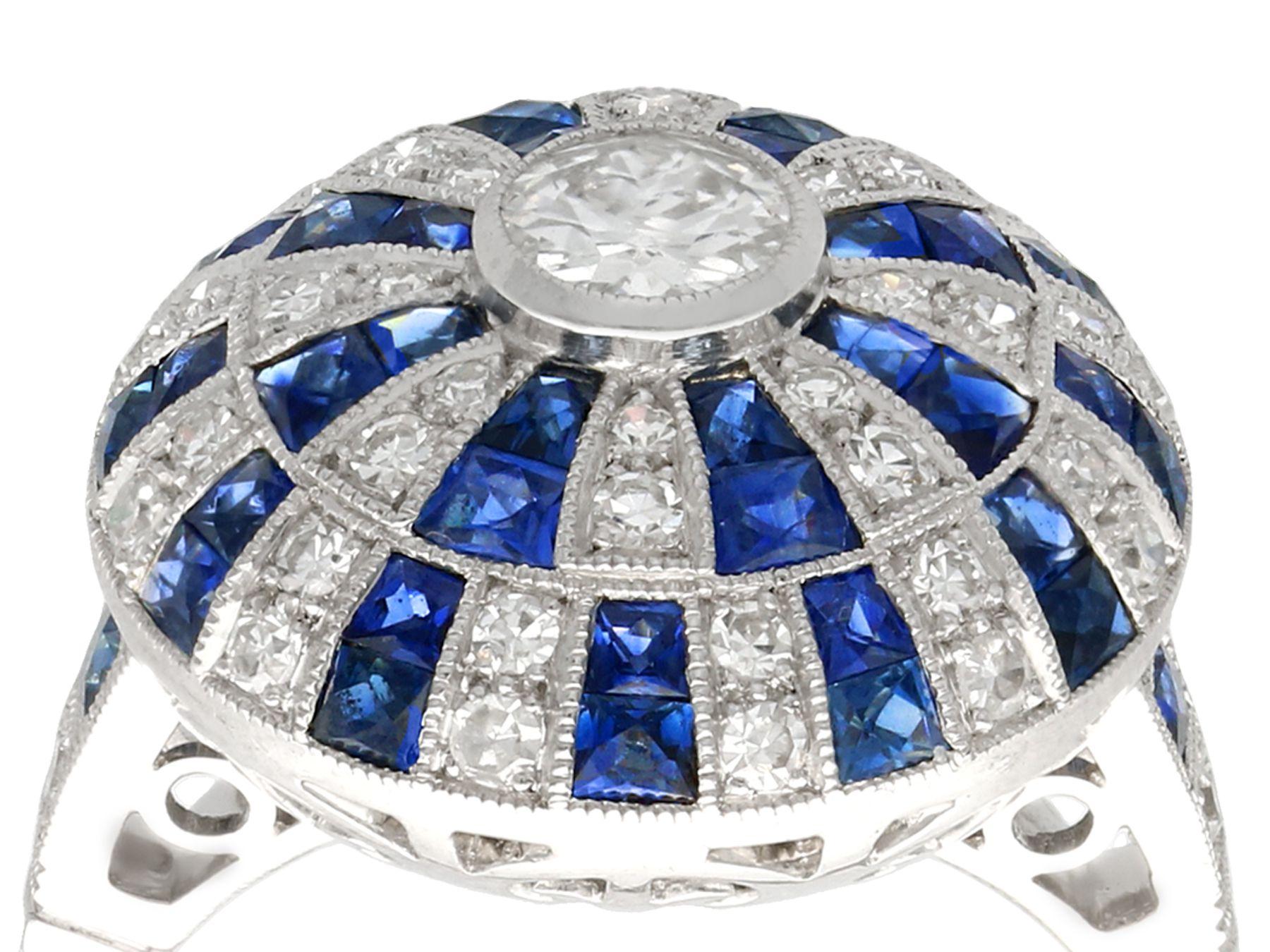 A stunning antique 0.98 carat diamond, contemporary 1.35 carat sapphire and platinum Art Deco style dress ring; part of our diverse gemstone jewelry and estate jewelry collections.

This stunning, fine and impressive Art Deco ring has been crafted