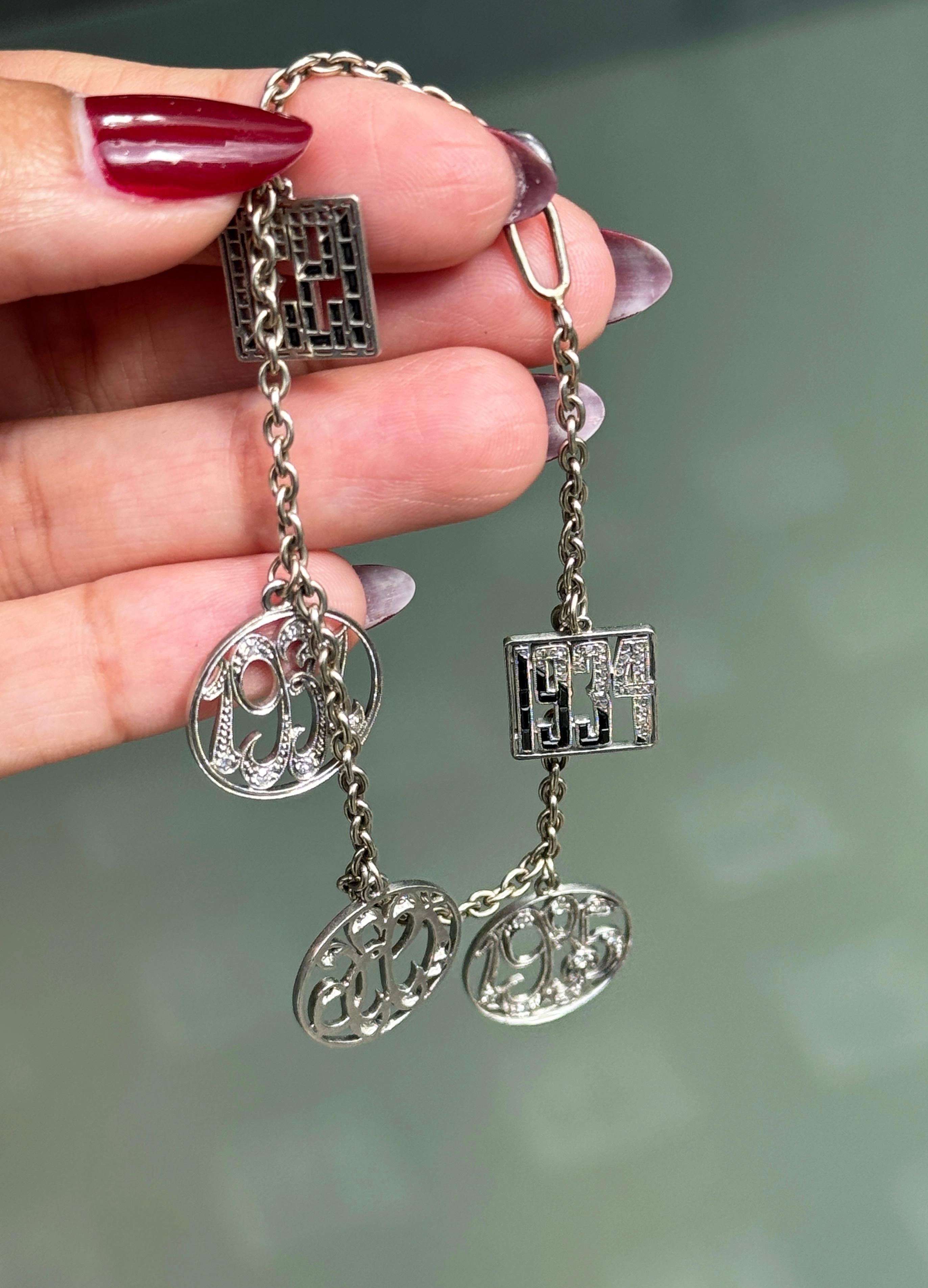 Antique Diamond and 14 Carat White Gold and Platinum Multi Charm Bracelet In Good Condition For Sale In London, GB